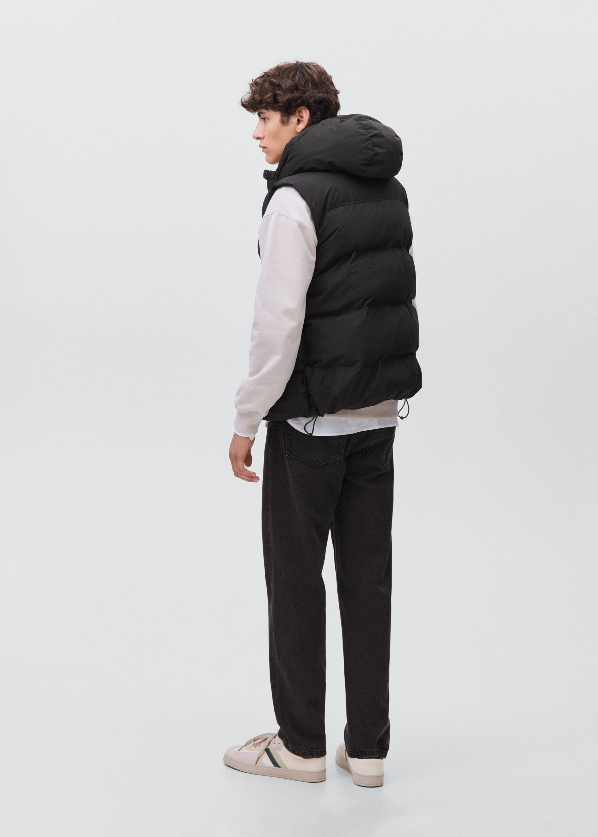 Quilted gilet with hood - Reverse of the article