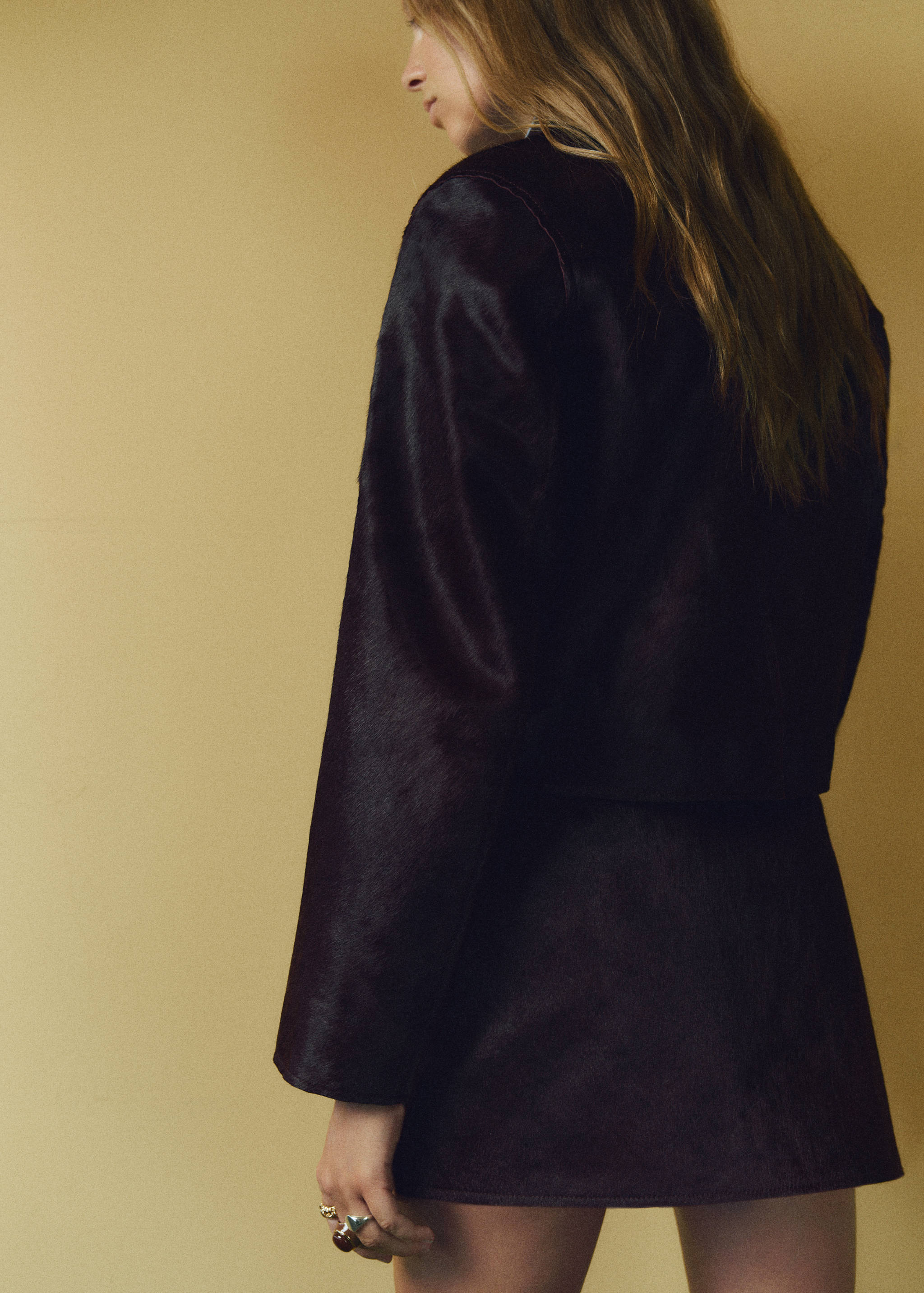 Veste en cuir et fausse fourrure à poches - Verso de l’article