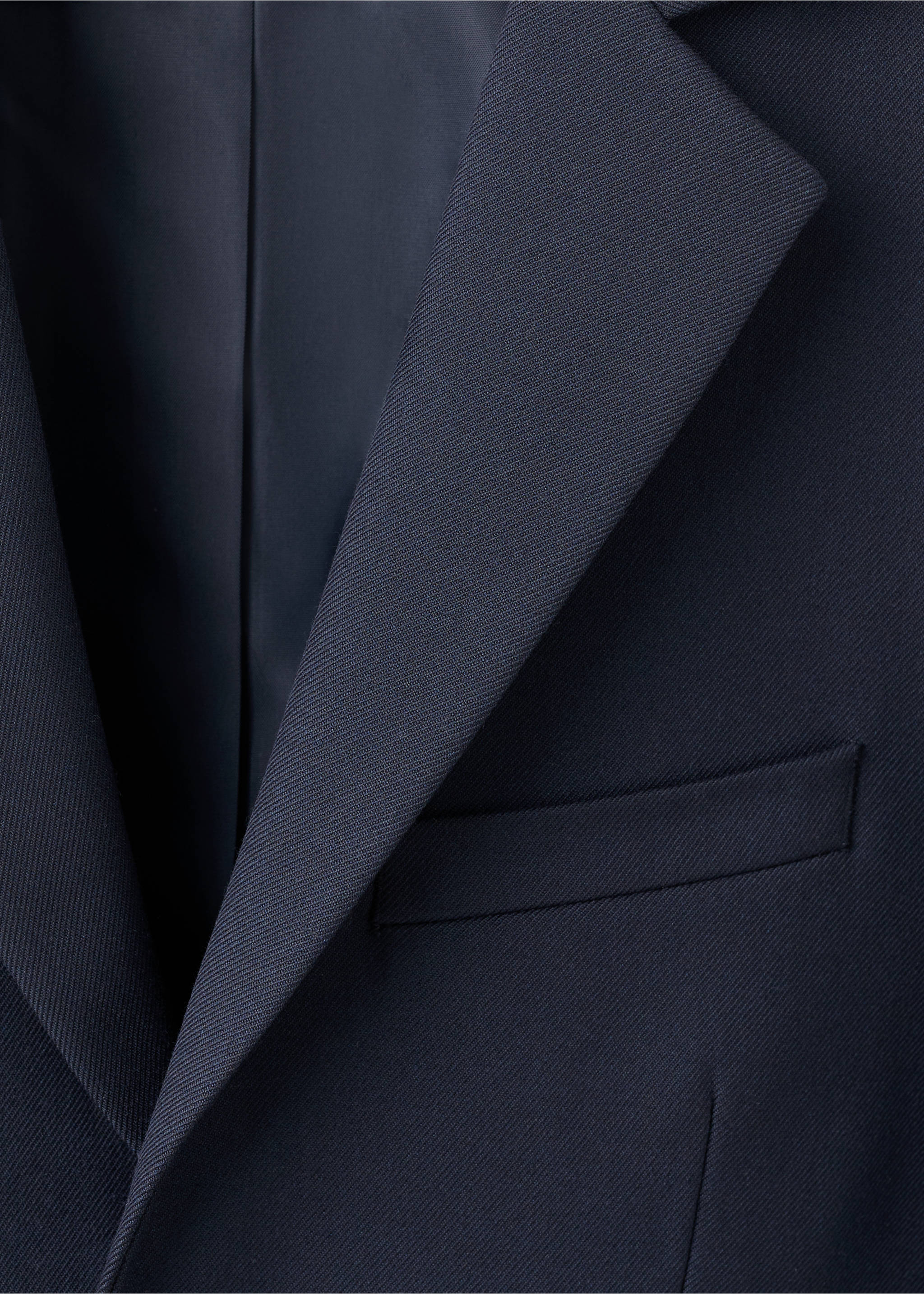 Close-up of a dark navy blue kids' jacket showing the lapel and chest pocket., Dark Navy. Ref: 17087759-00.