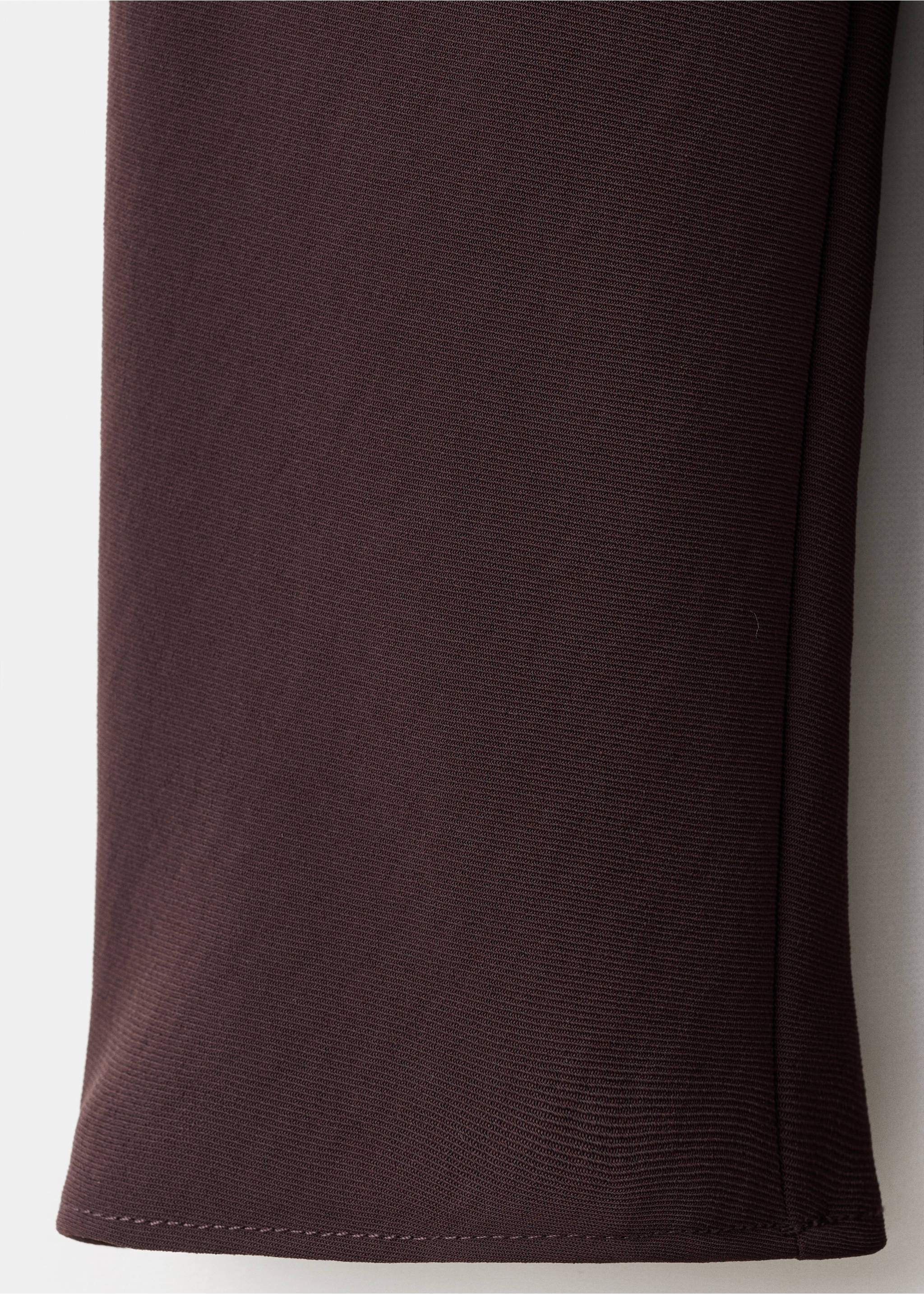 Close-up of the fine-ribbed fabric texture on a dark plum blouse., Brown. Ref: 17087791-00.