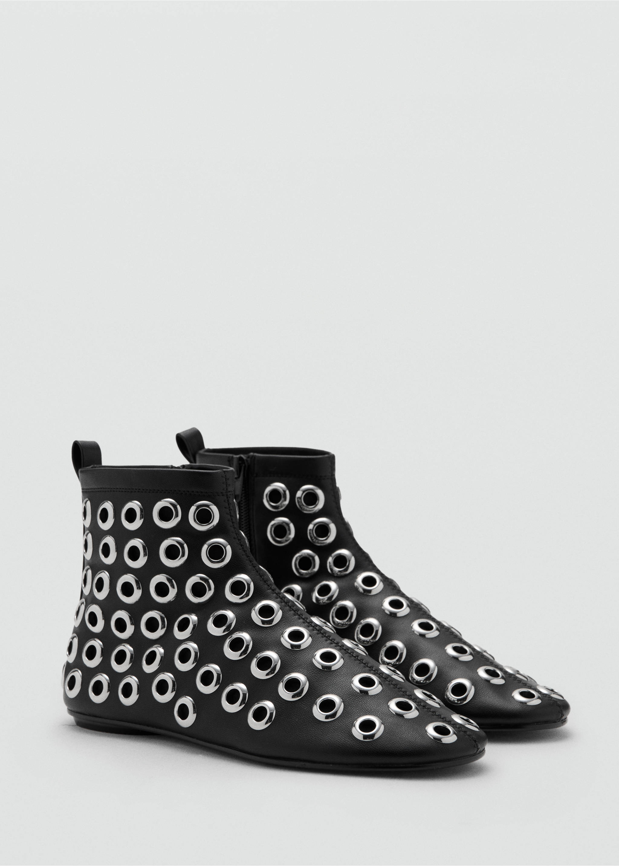 Black ankle boots embellished with all-over silver-tone metallic eyelets., Black. Ref: 17088633-00.