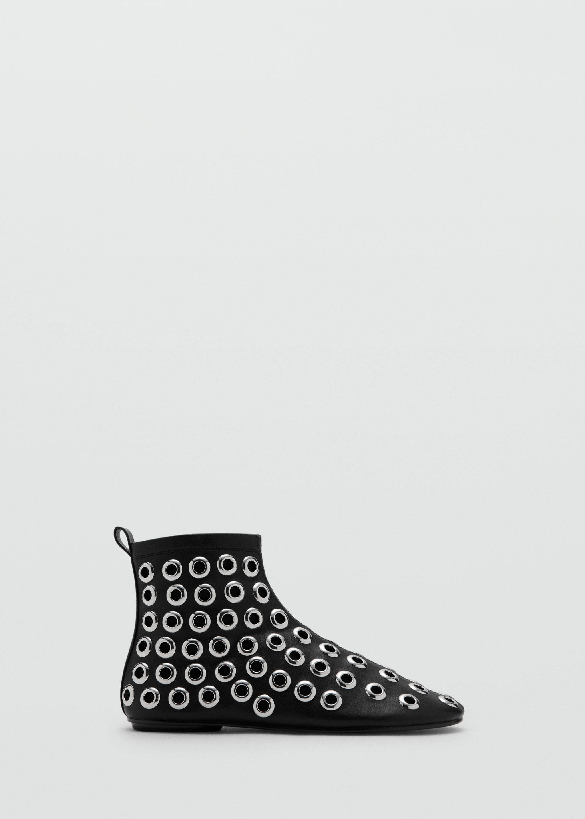 Black ankle boot with silver eyelets and a low heel.