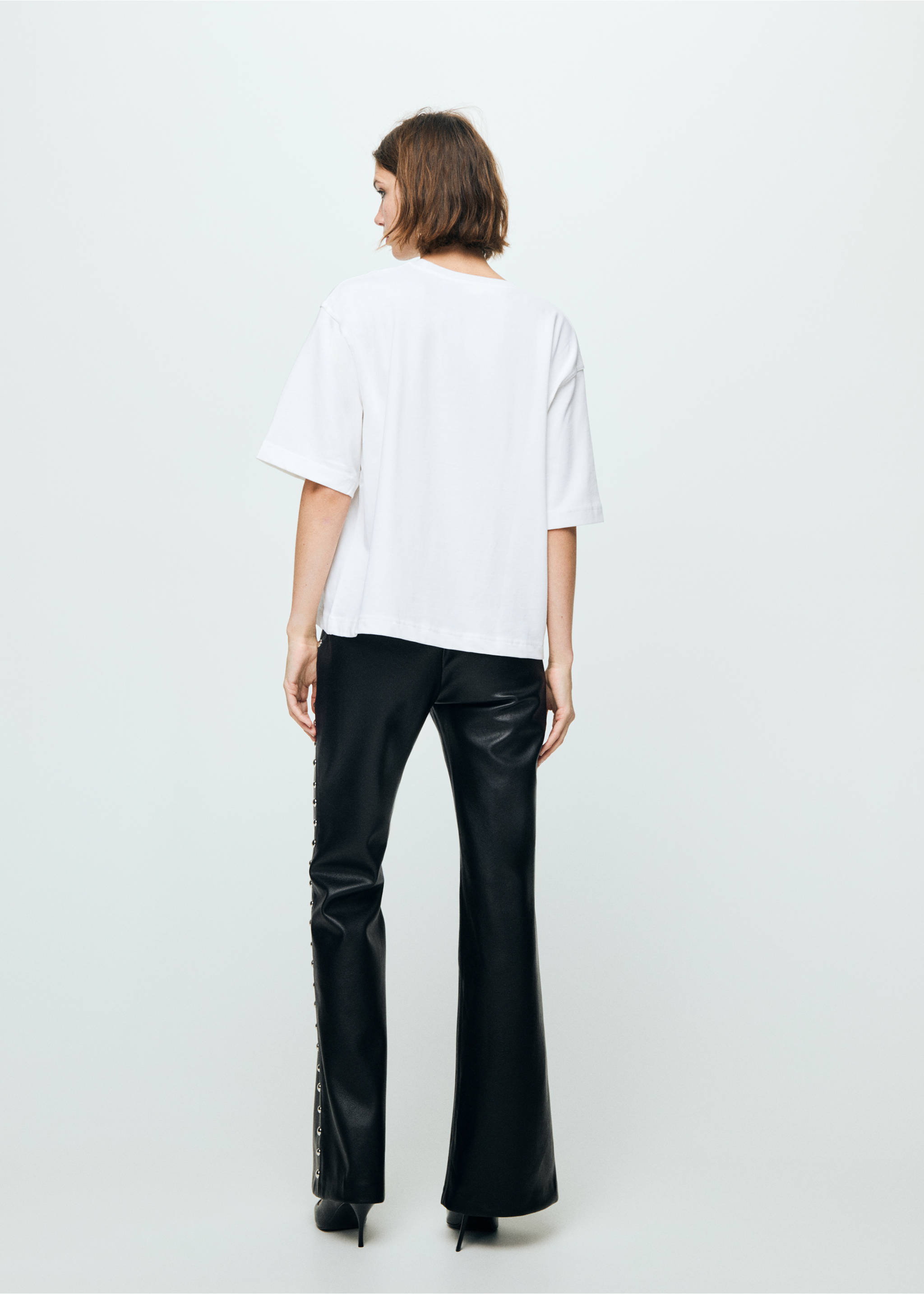 Studded faux-leather trousers - Reverse of the article, Black. Ref: 17089109-00.