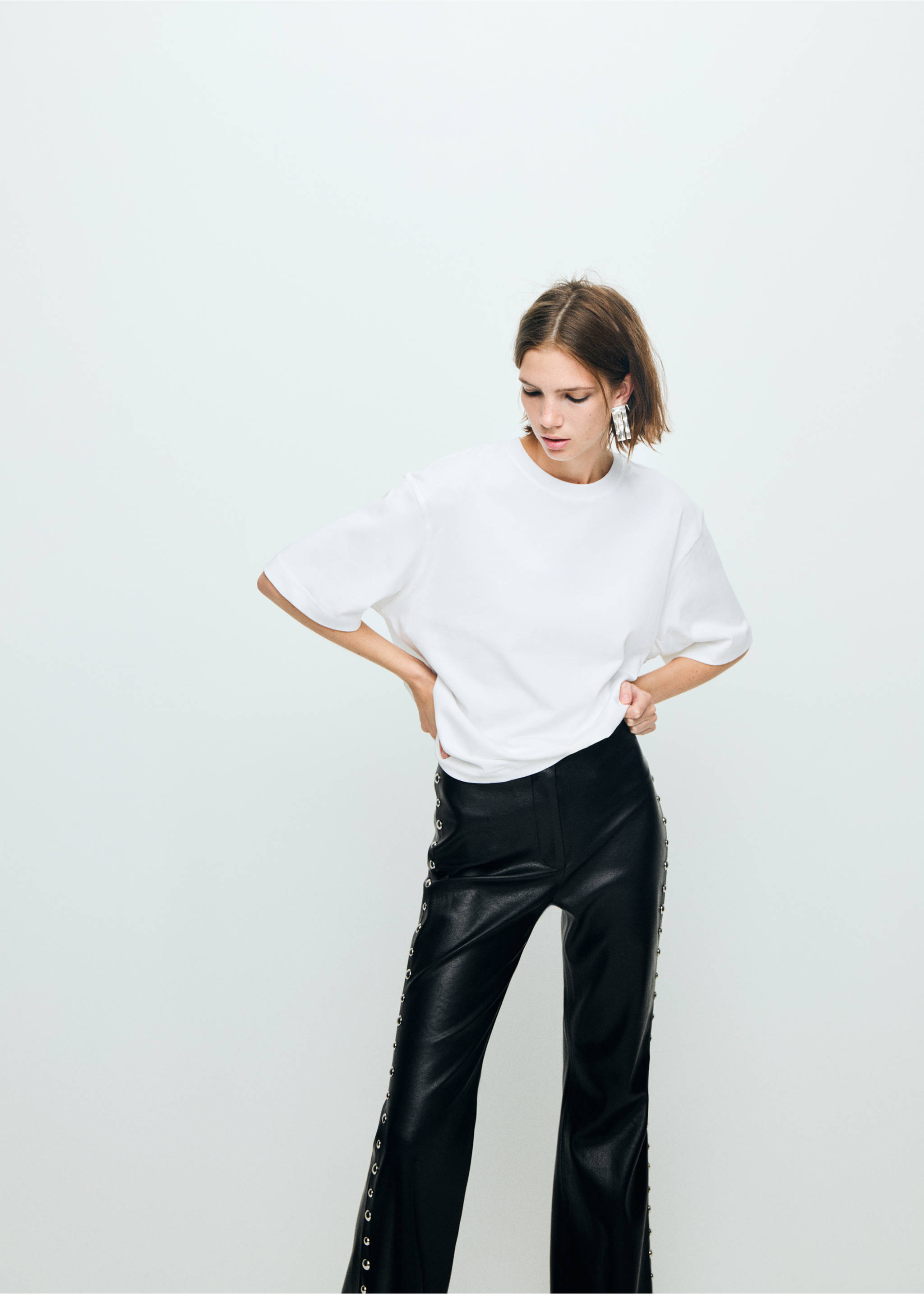 Studded faux-leather trousers - Details of the article 1, Black. Ref: 17089109-00.