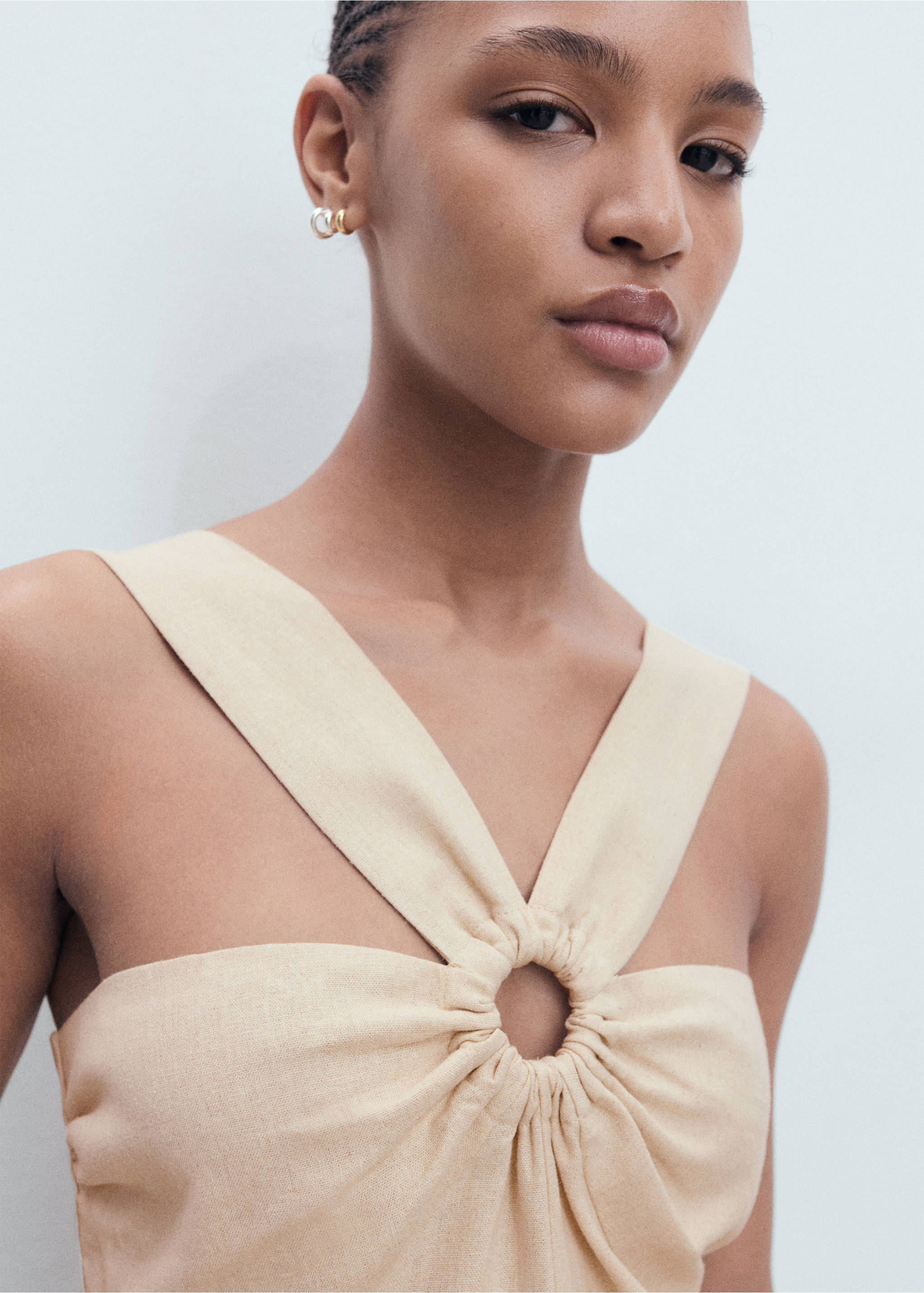 Linen jumpsuit with hoop detail - Details of the article 1, Sand. Ref: 17092029-00.