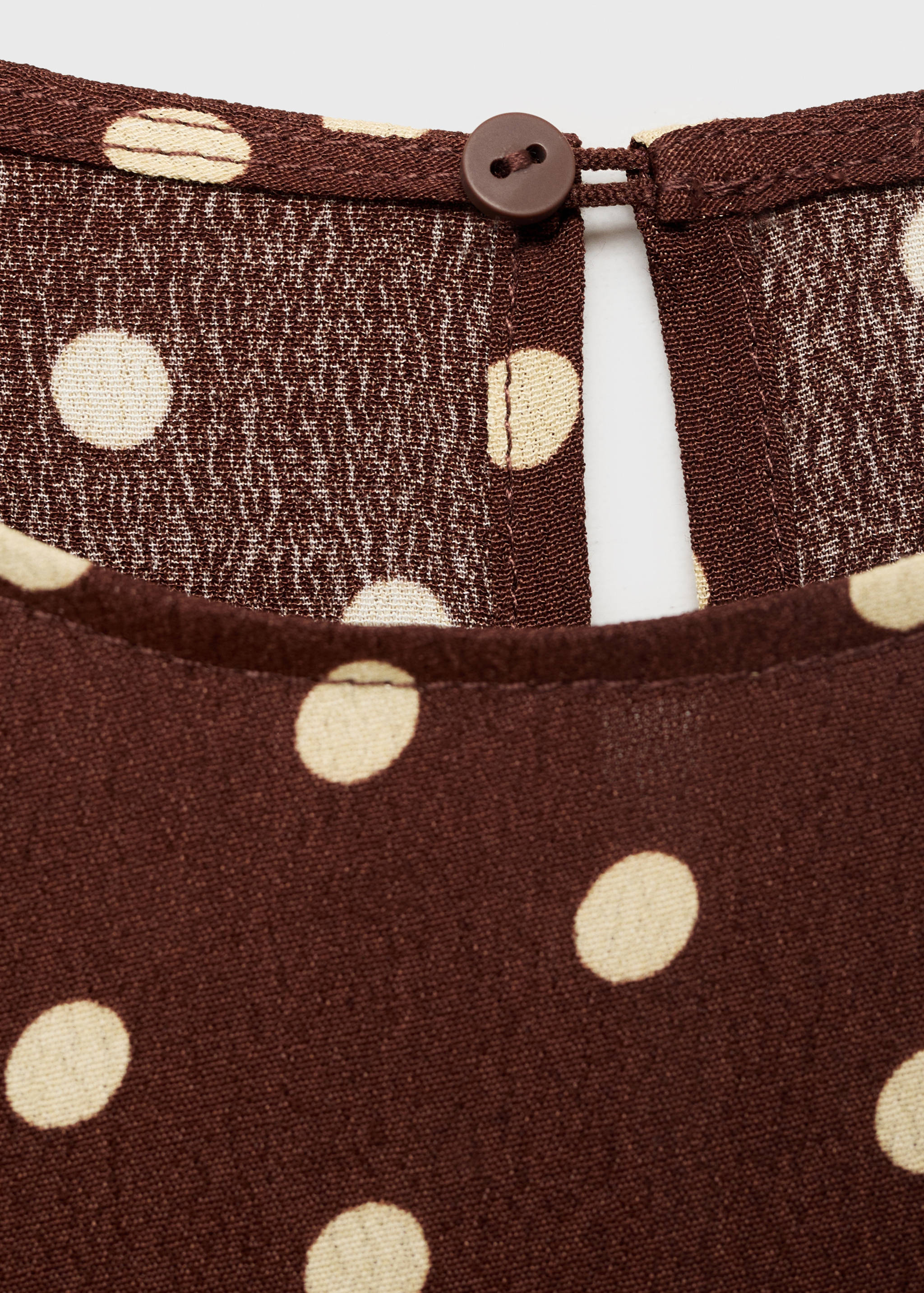 Vestido às bolas com laço - Pormenor do artigo 8