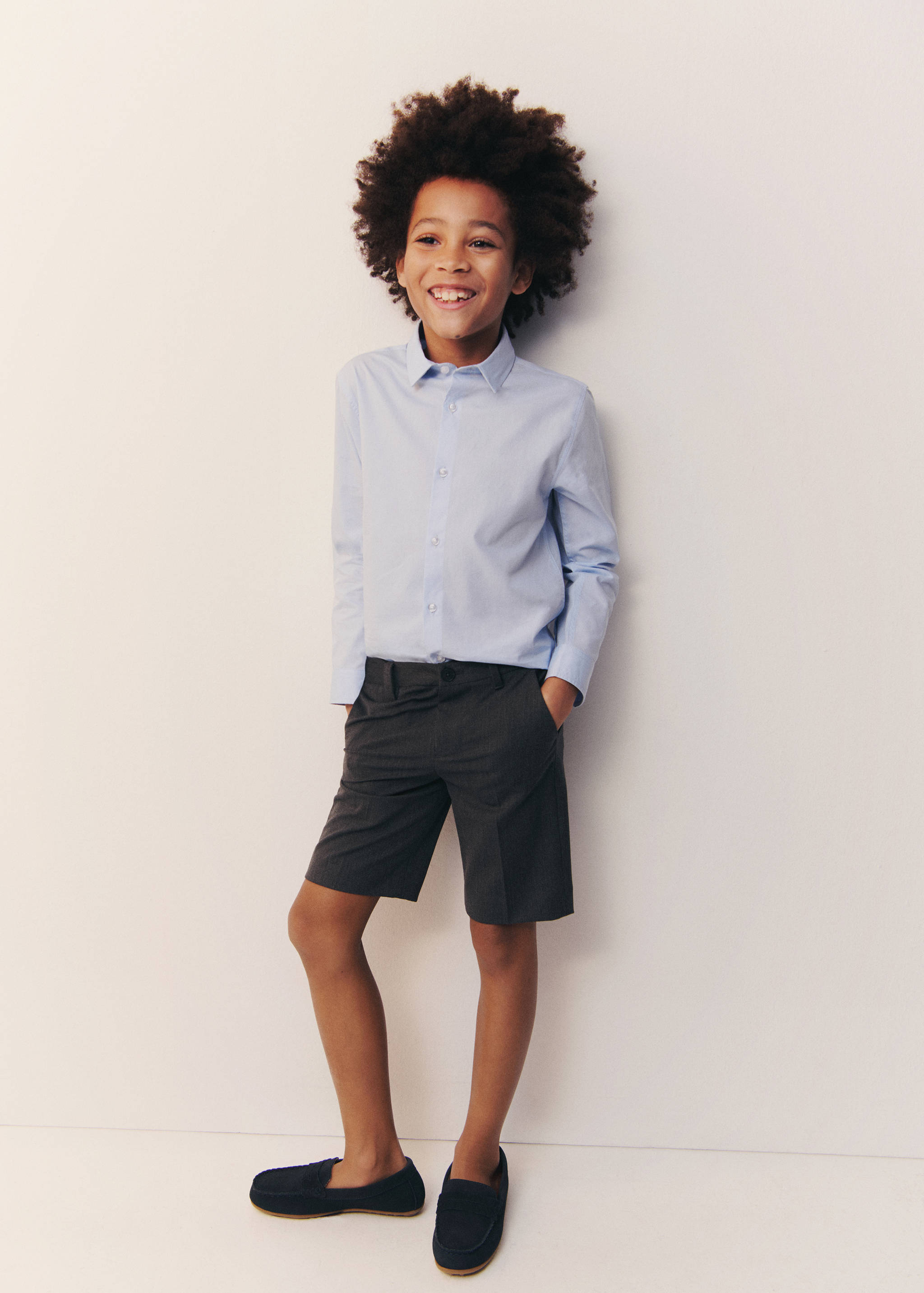 Light blue long-sleeved shirt with classic collar and front buttons.