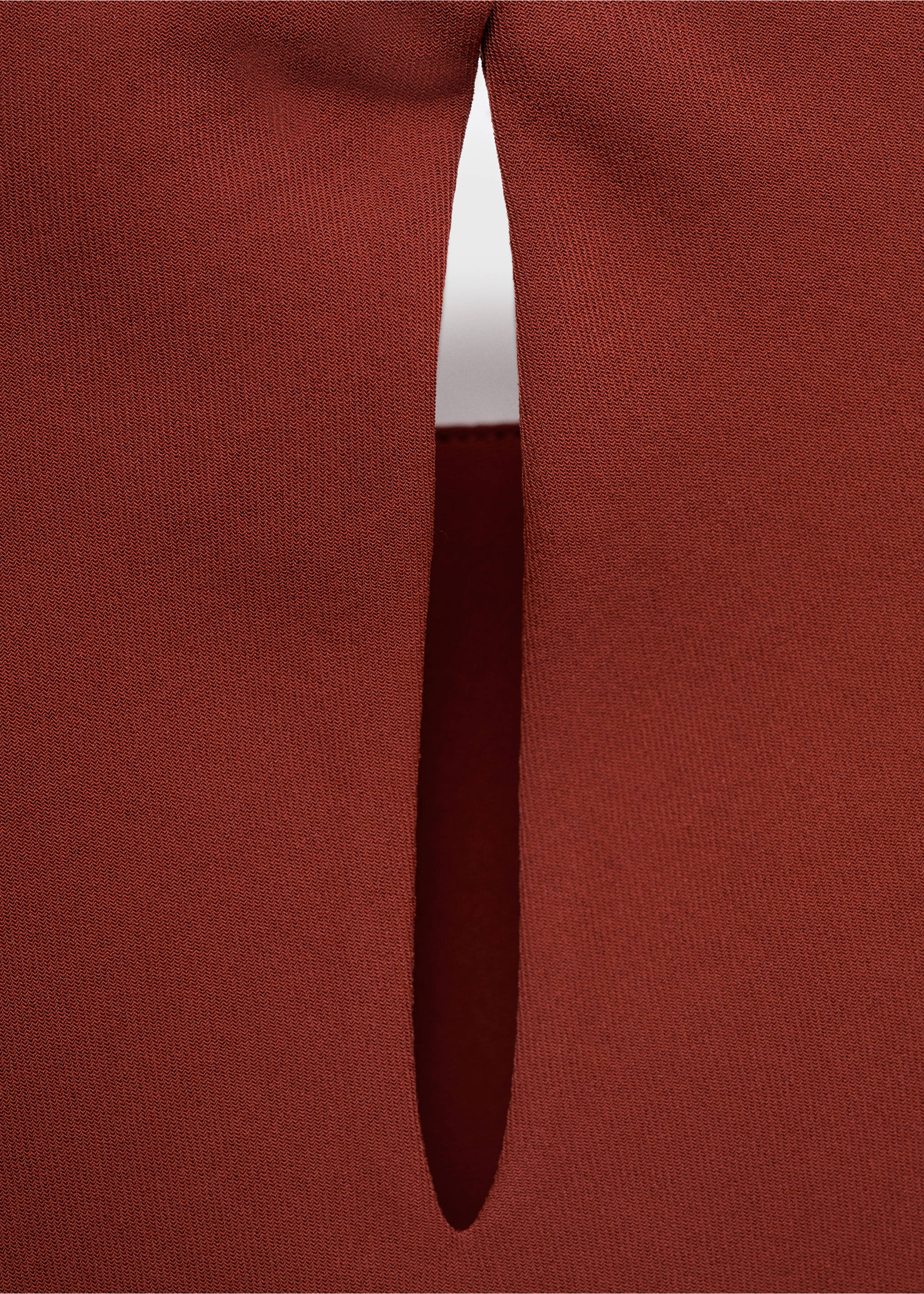 Rust-red blouse detail showcasing a vertical slit., Burnt Orange. Ref: 17095803-00.