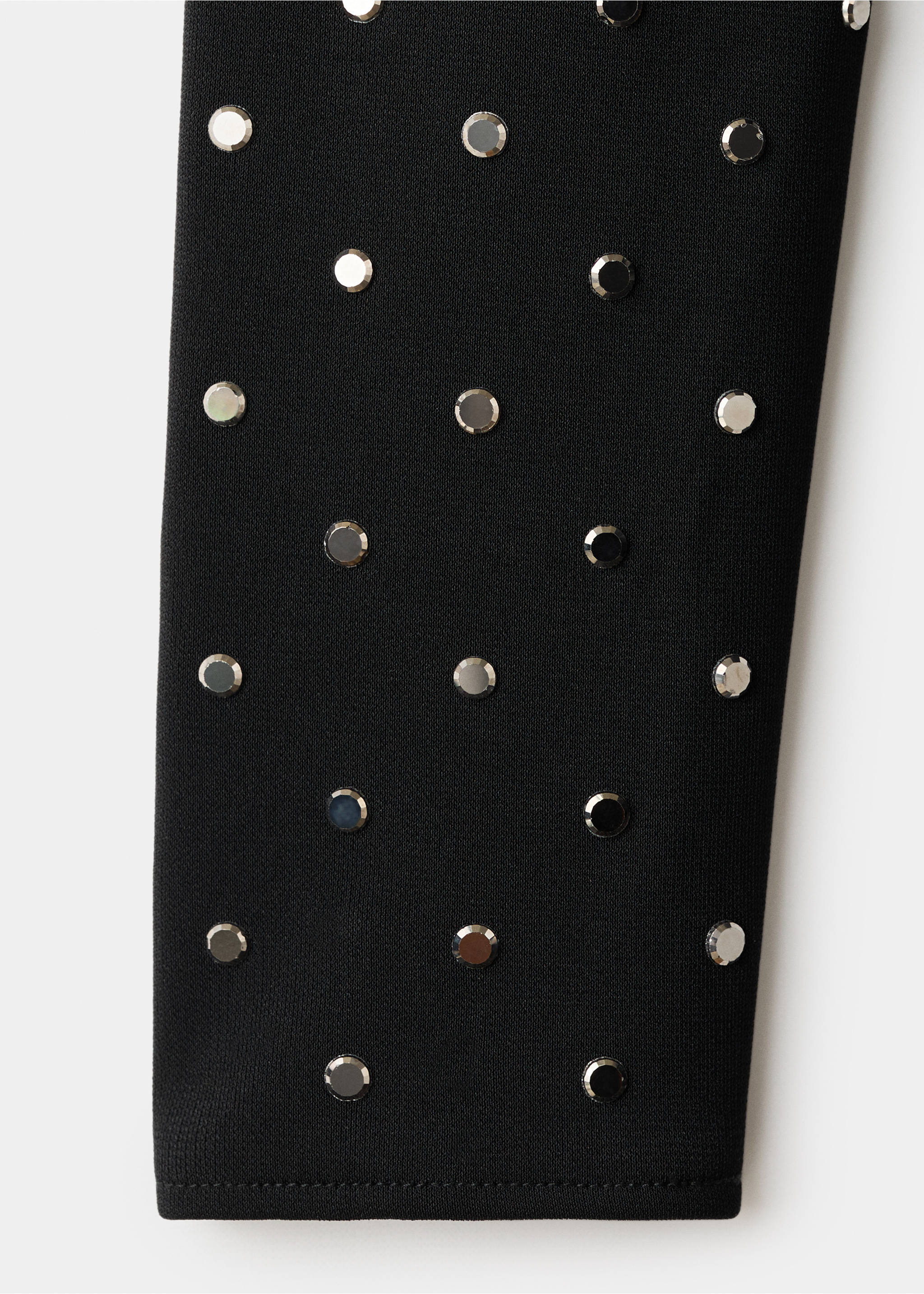 Black dress fabric detail with silver metallic studs., Black. Ref: 17096356-00.
