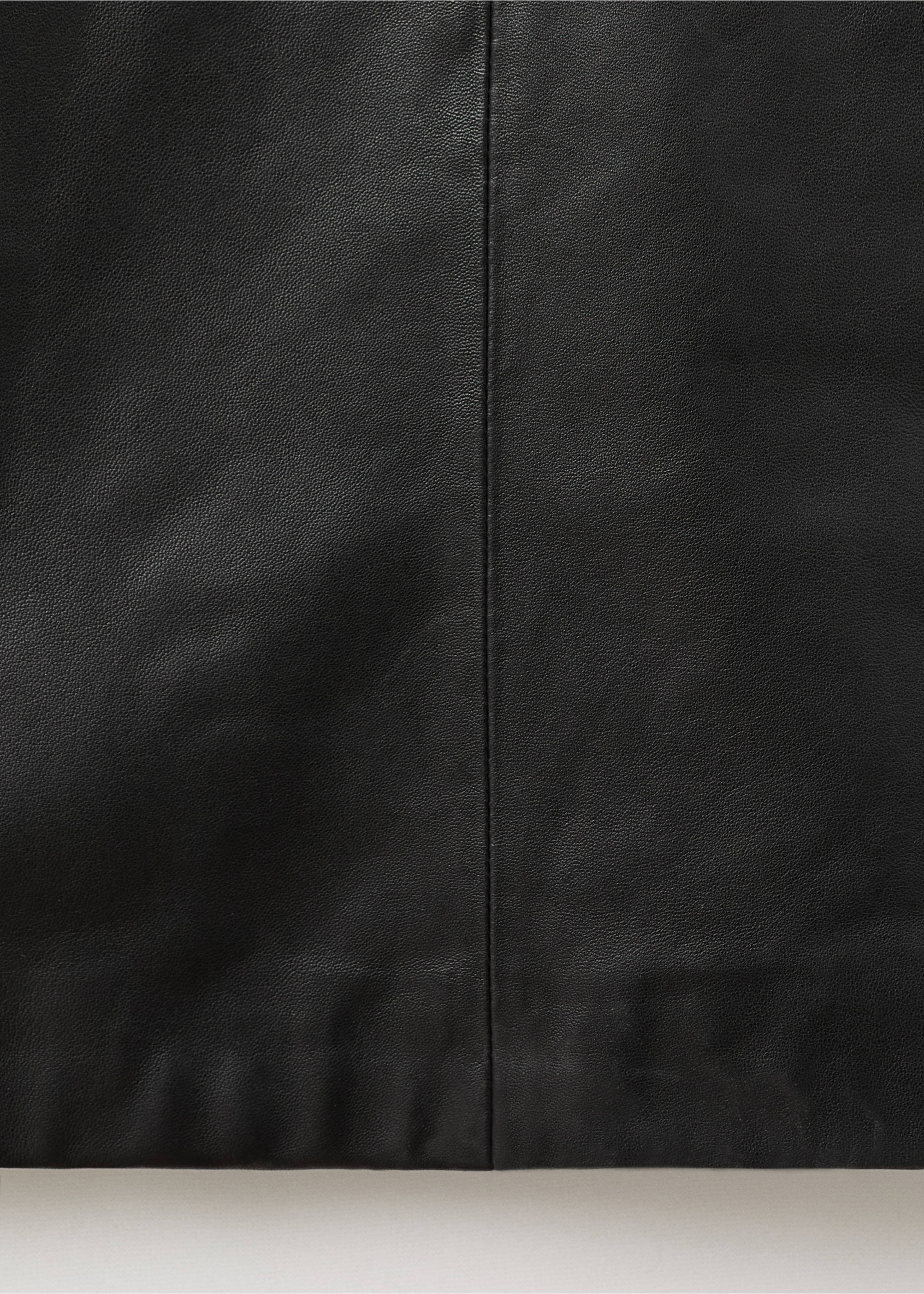 Close-up of a black dress detail showing the vertical center seam., Black. Ref: 17096357-00.
