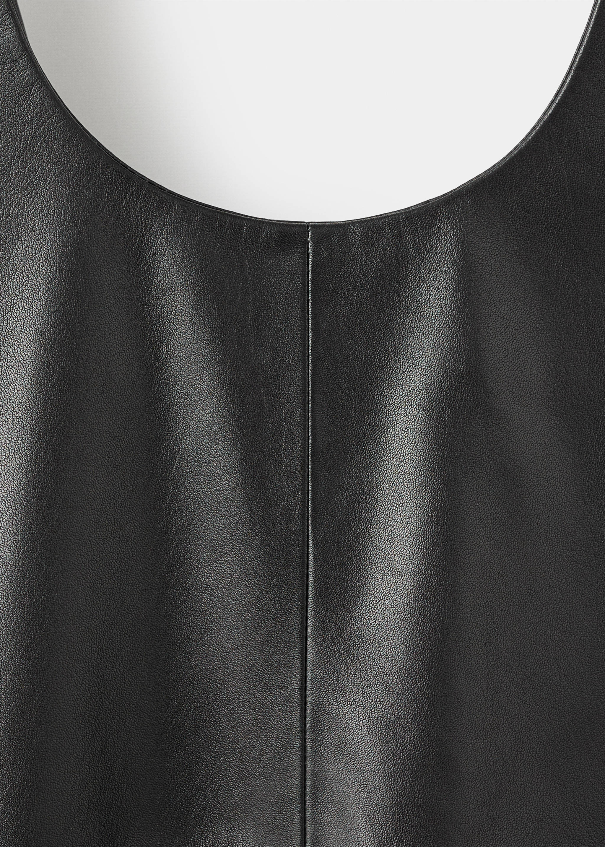 Black leather dress fabric detail showing the texture and neckline., Black. Ref: 17096357-00.
