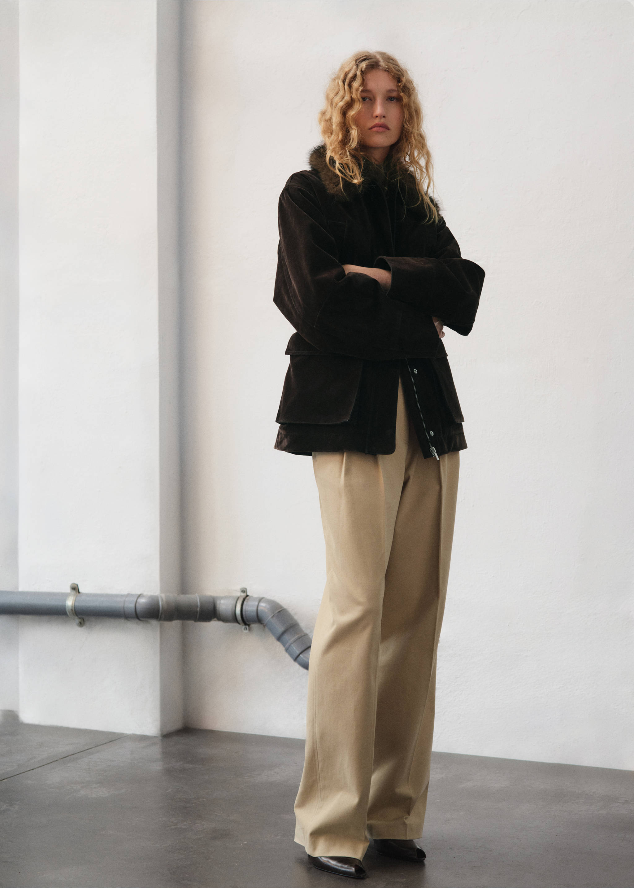 Dark brown parka with faux-fur collar worn with beige trousers., Chocolate. Ref: 17097804-00.