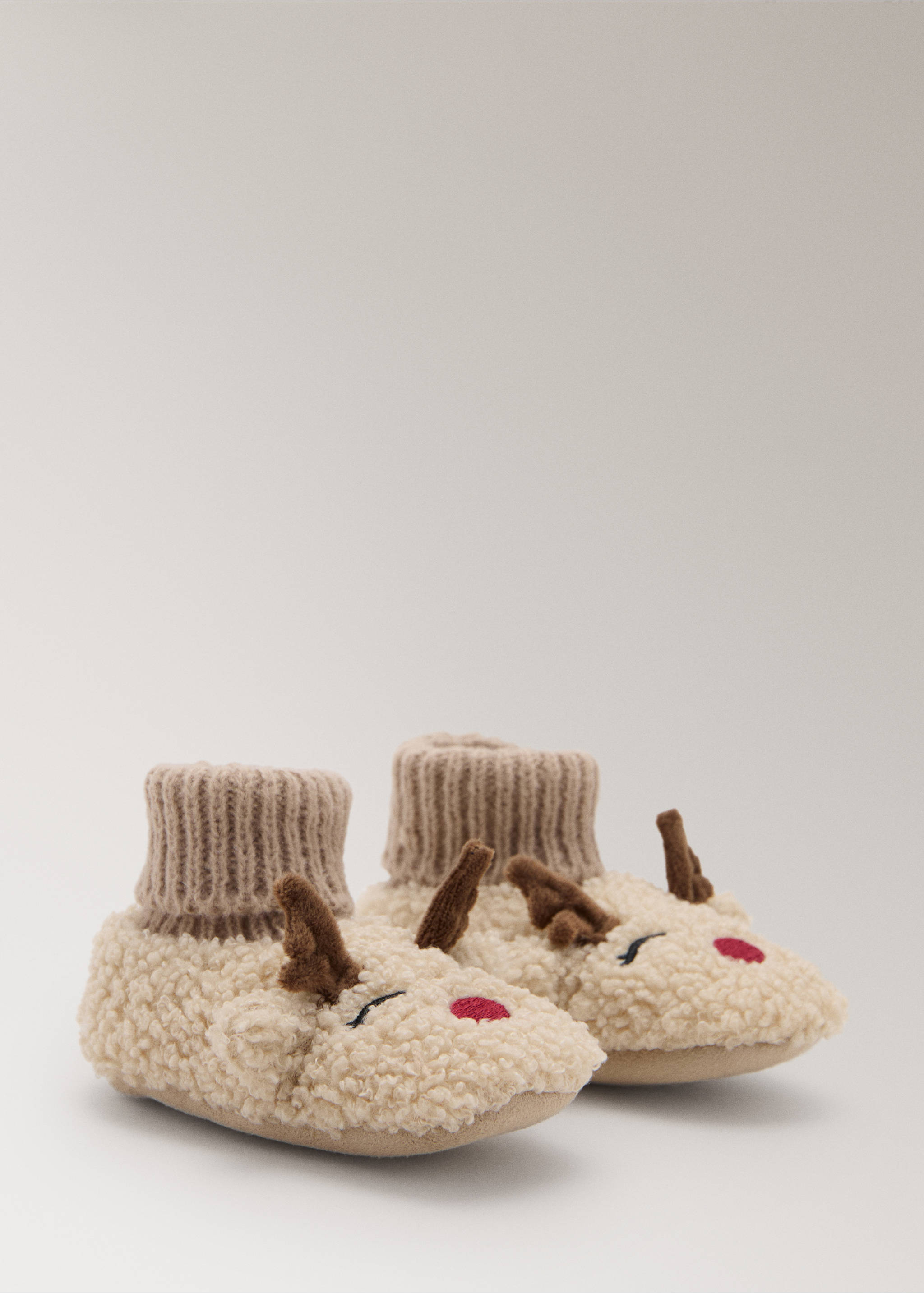 Plush cream reindeer house slippers with brown antlers and ribbed knit cuffs., Sand. Ref: 17097903-00.