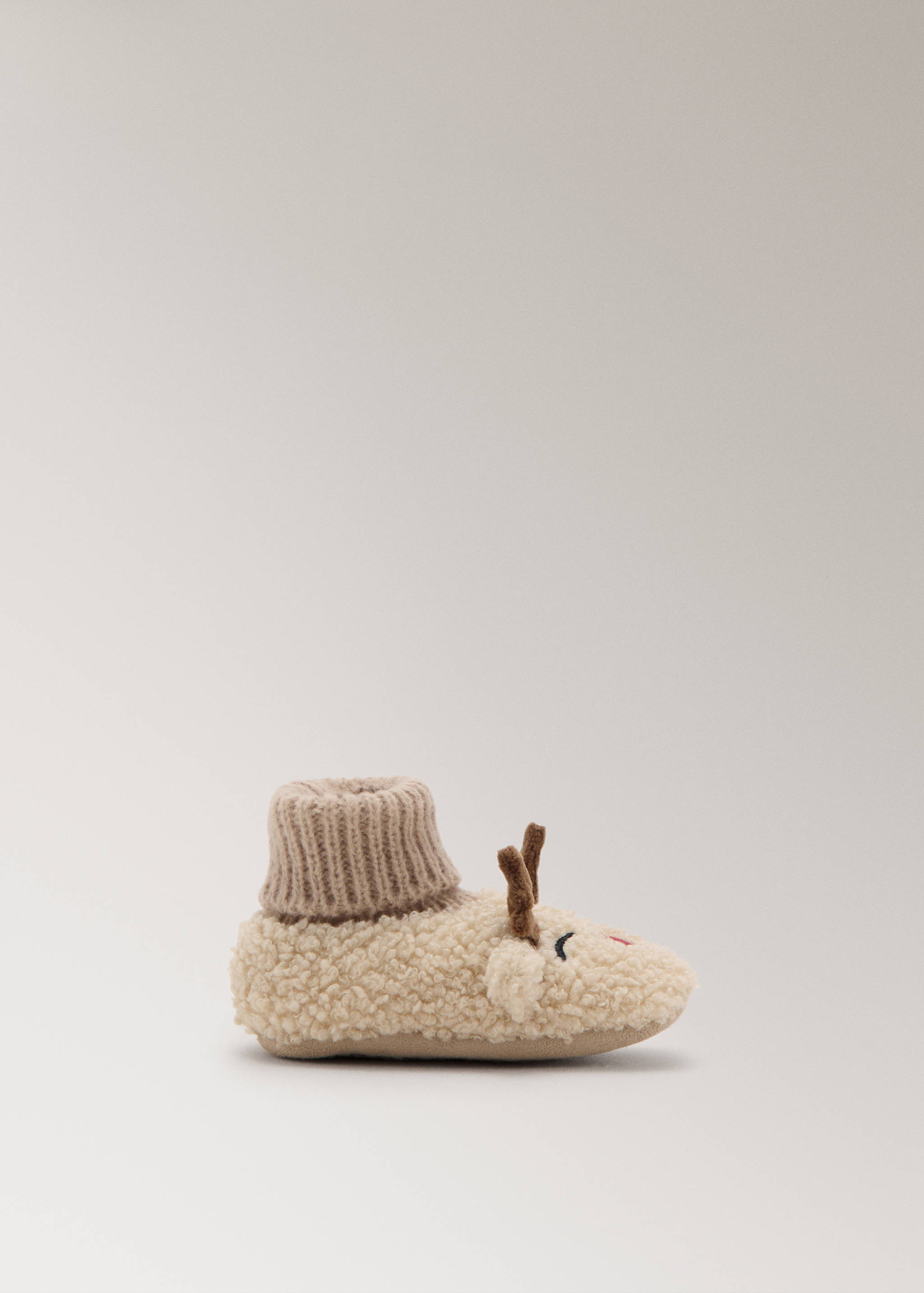 Off-white faux-shearling reindeer house slipper with knit ankle collar.