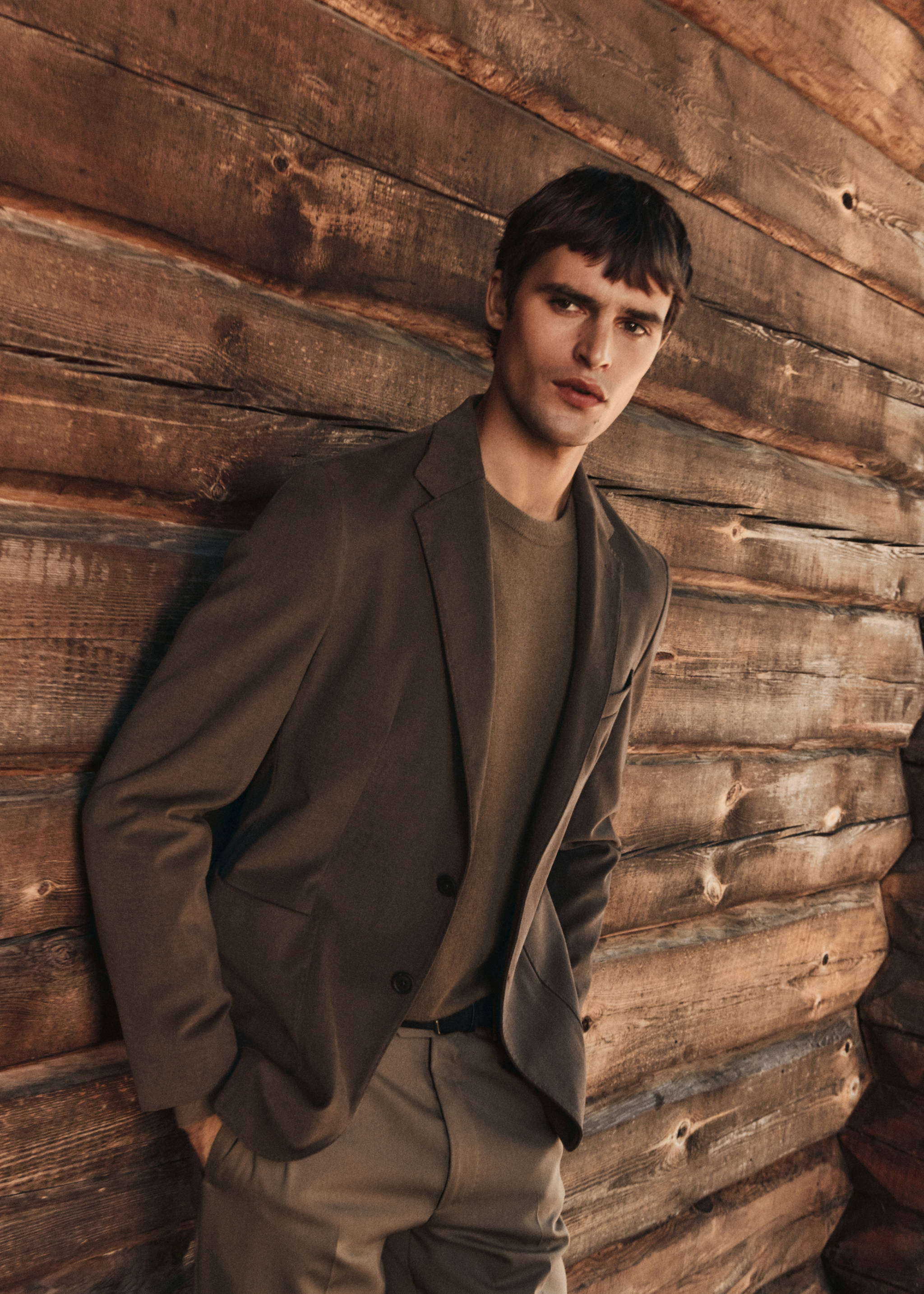 Brown single-breasted blazer with notched lapels and two buttons.