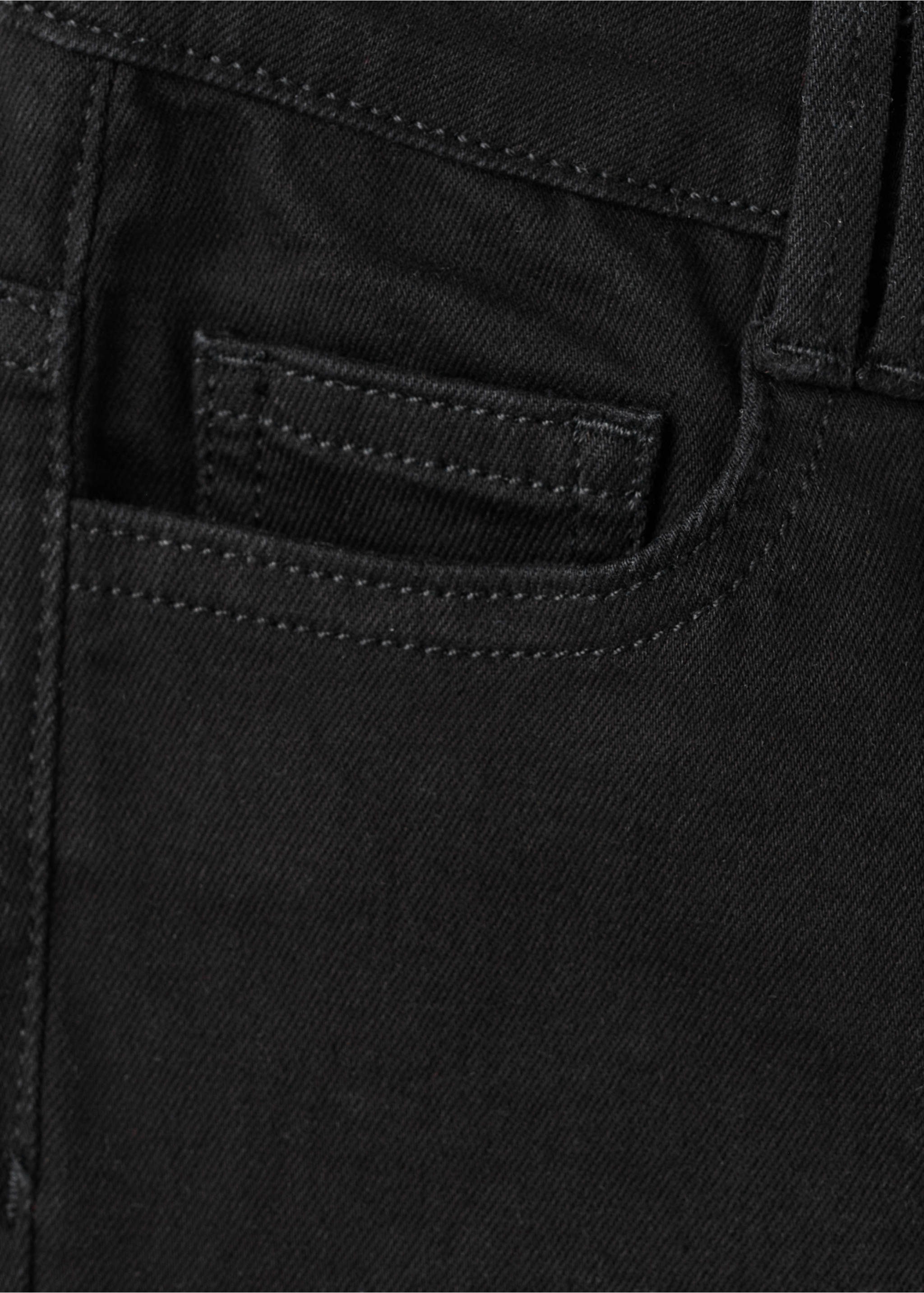 Close-up of black denim trousers fabric and pocket detail., Black denim. Ref: 27001257-00.