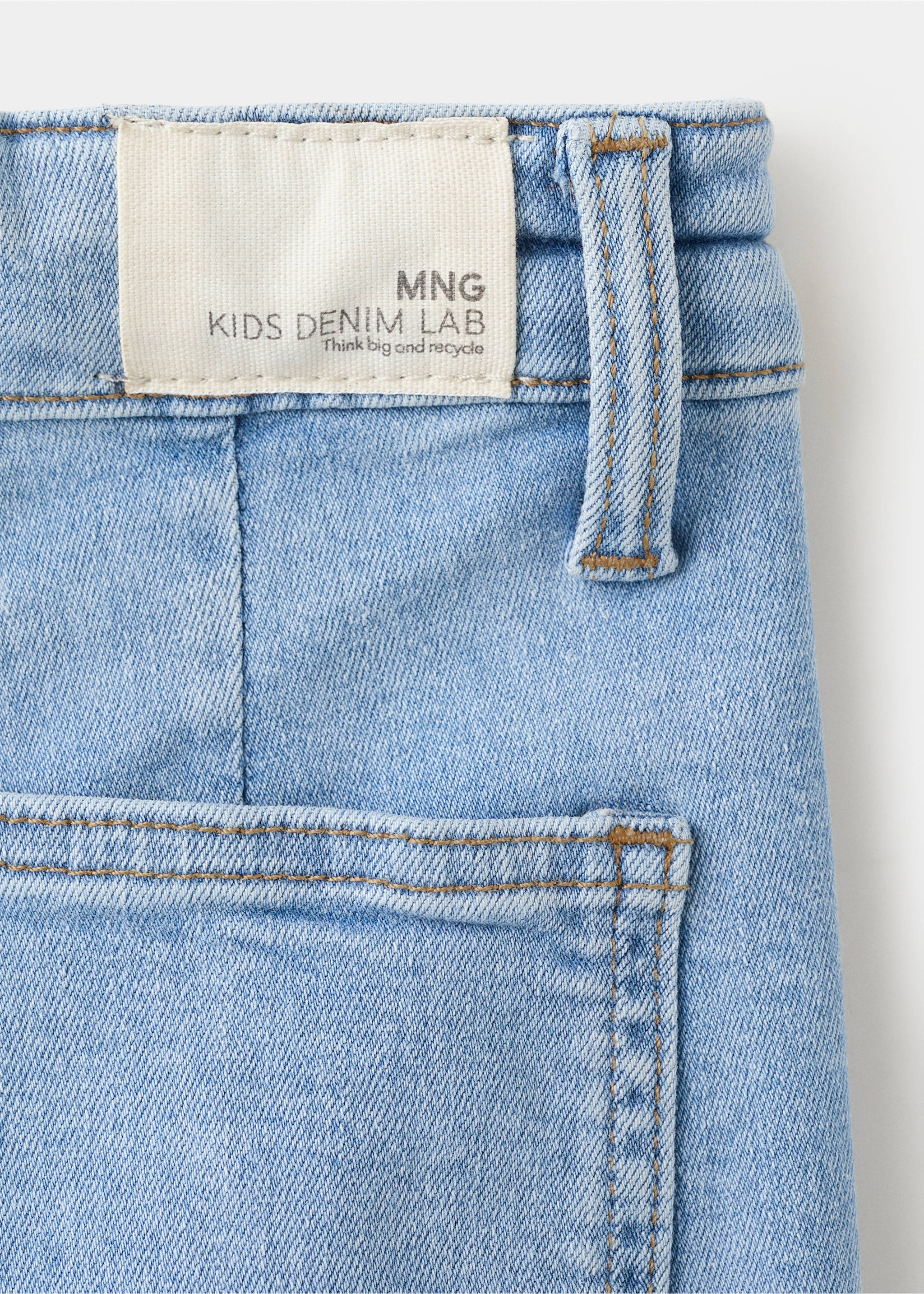 Close-up of light blue kids' denim trousers showing the waistband label and back pocket., Medium Blue. Ref: 27001259-00.