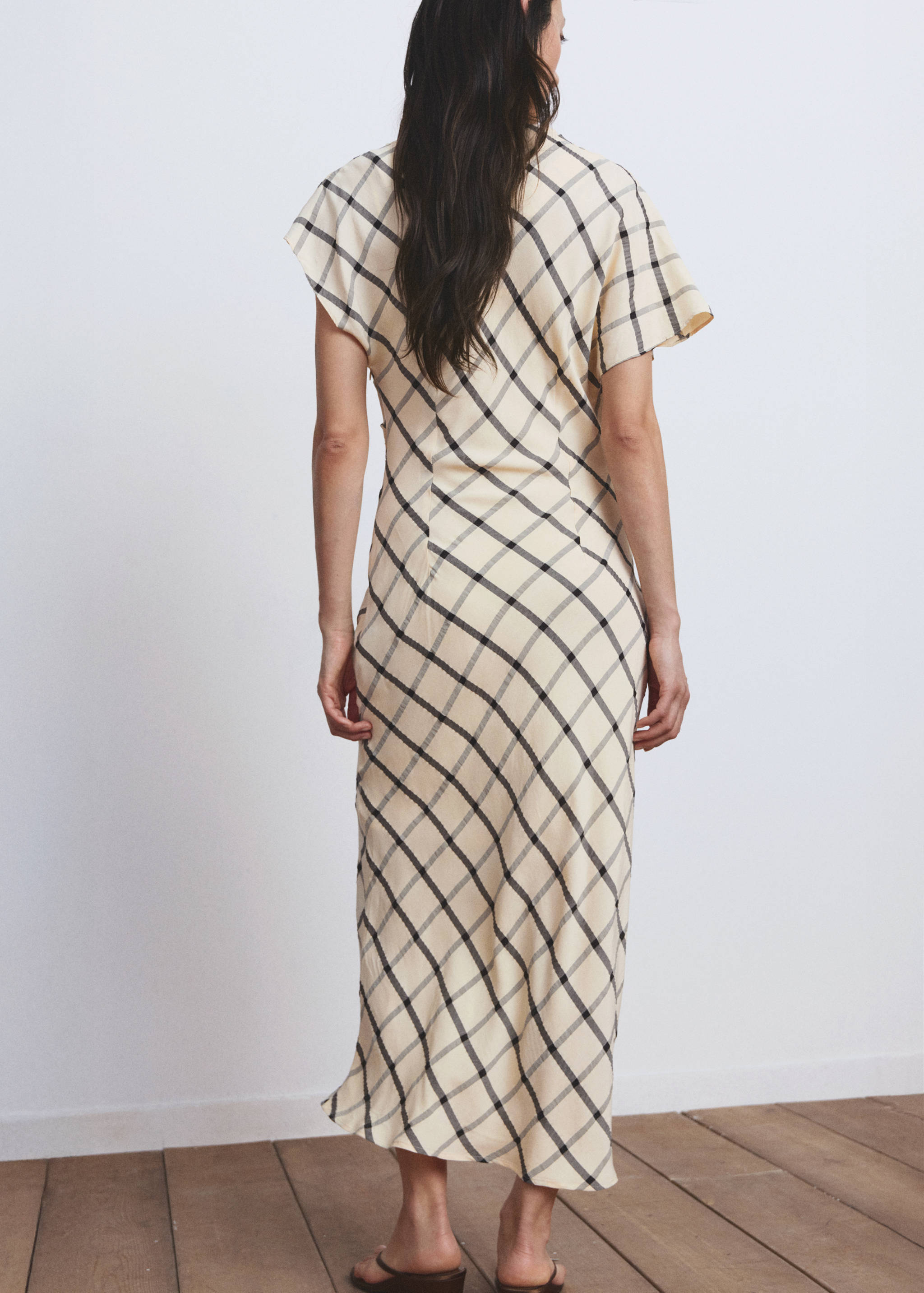 Cream check midi dress with short flutter sleeves, back view.
