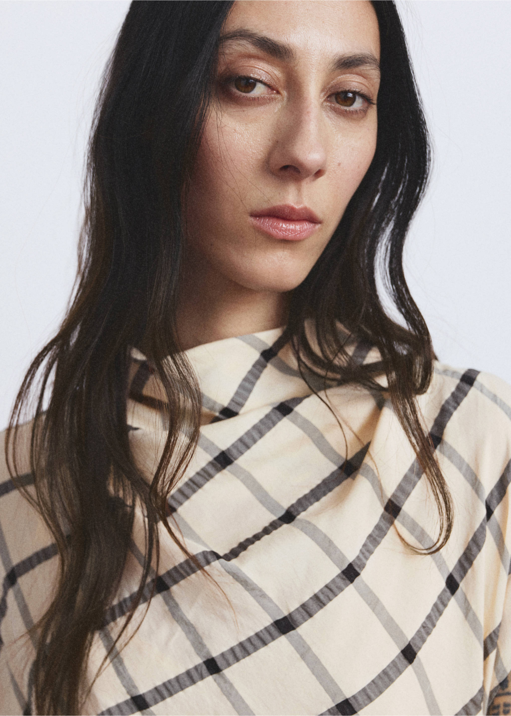 Close-up of a cream-coloured plaid dress with a draped high neckline., Ecru. Ref: 27009100-00.