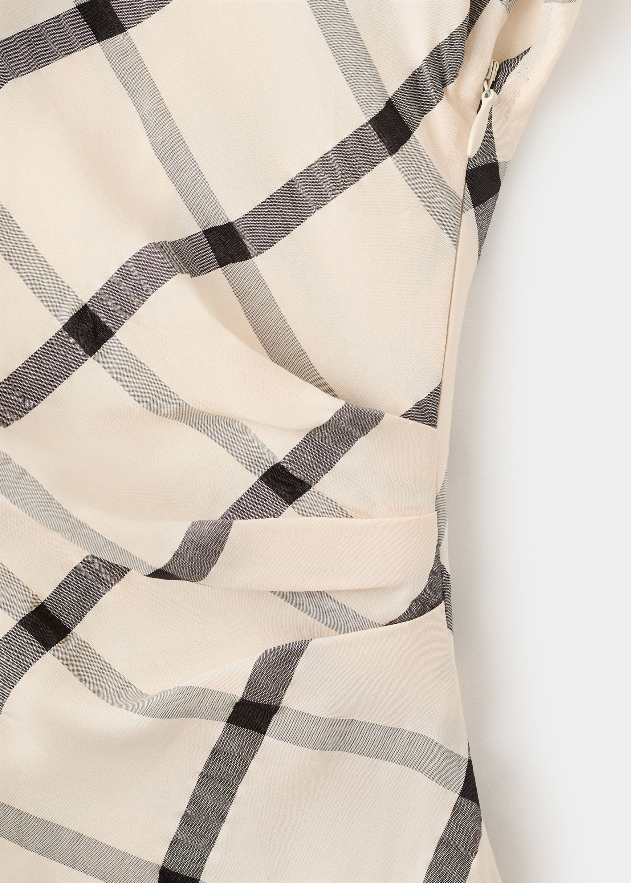 Close-up of a cream checked dress featuring draped side details and a concealed zipper., Ecru. Ref: 27009100-00.