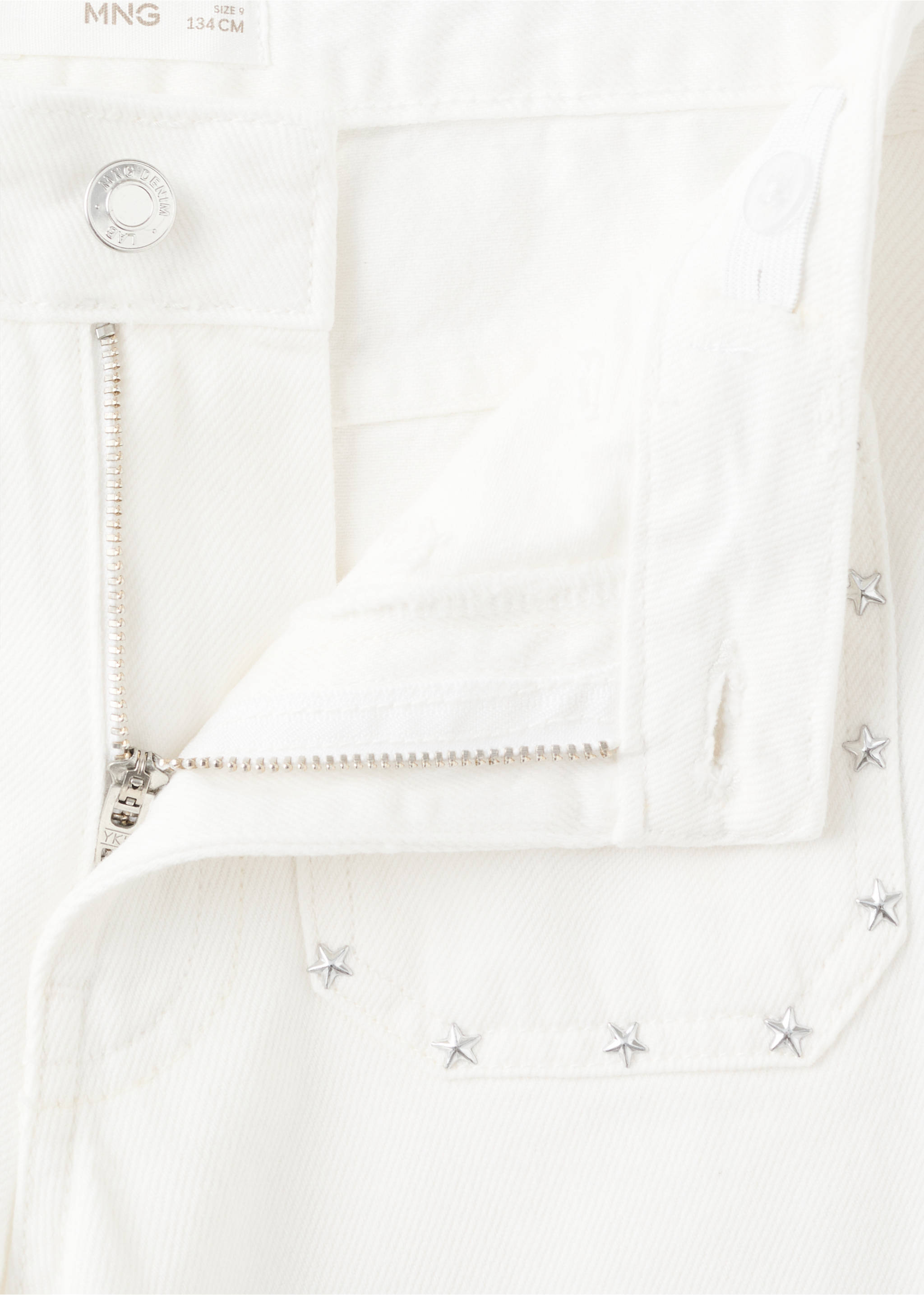 Close-up of white denim culotte fly and star-studded pocket., White. Ref: 27011263-00.