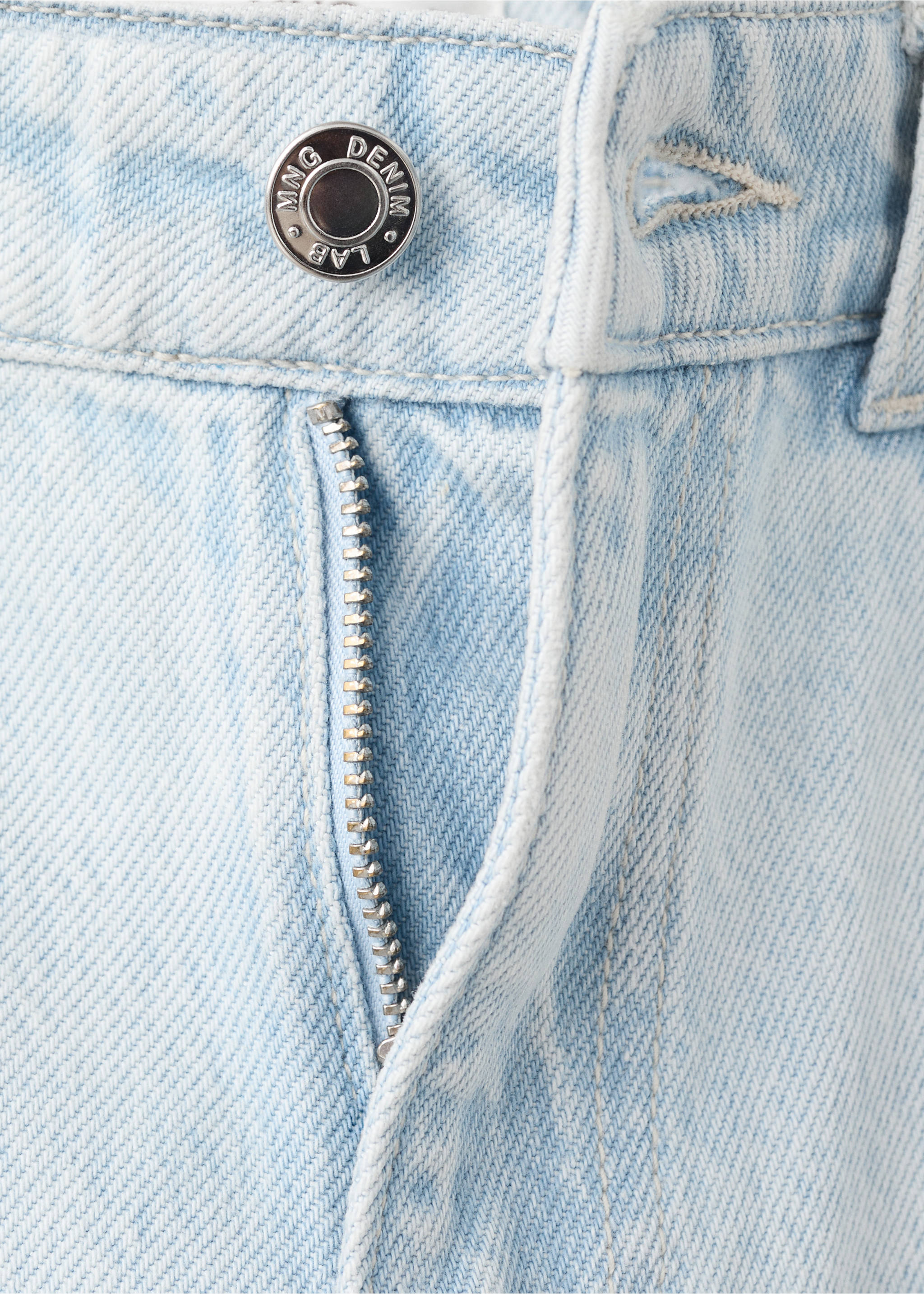 Close-up of light blue denim trousers waistband and zip fly., Light Blue. Ref: 27011264-00.