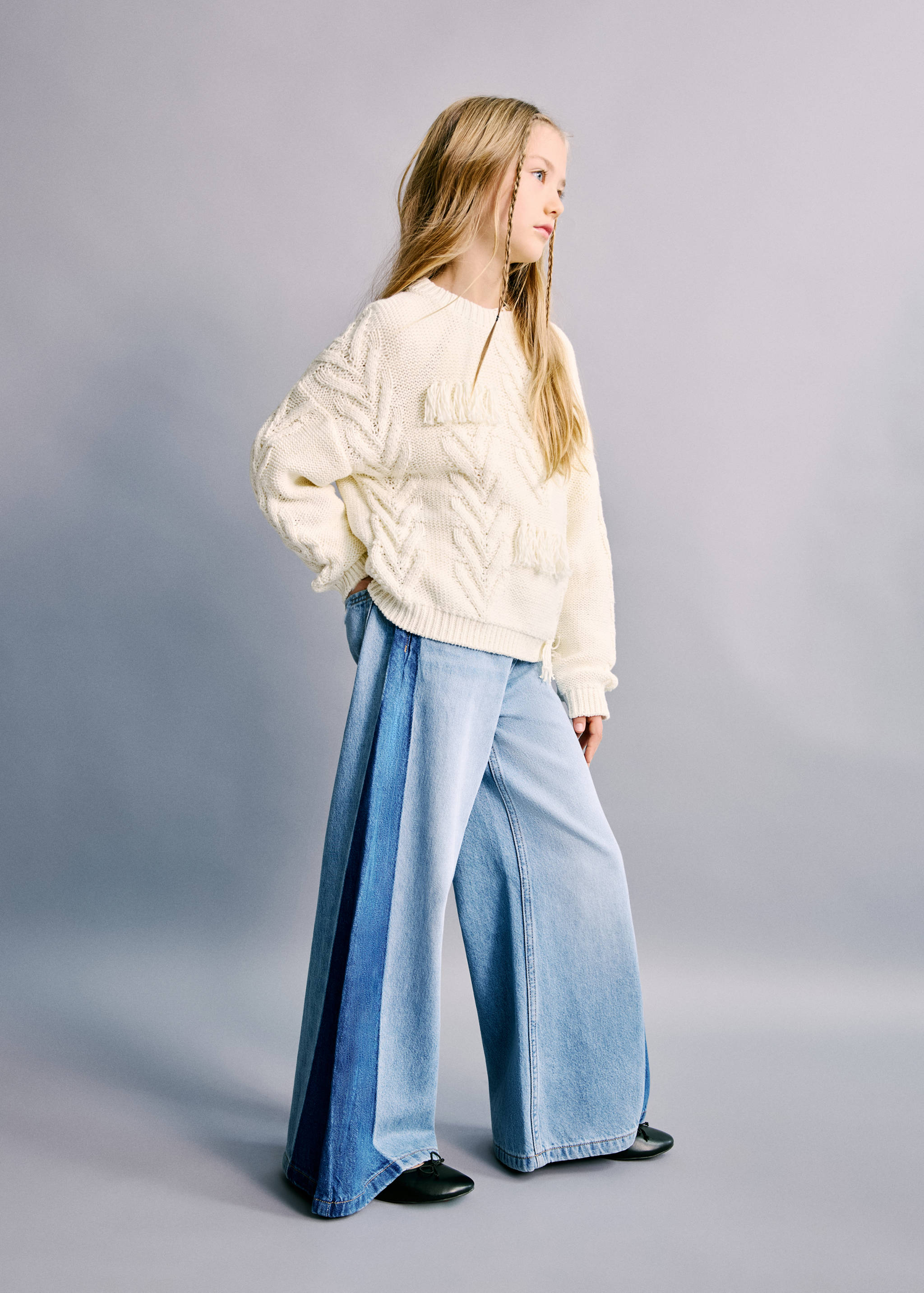 Light blue wide-leg denim trousers with contrasting dark blue side panels.