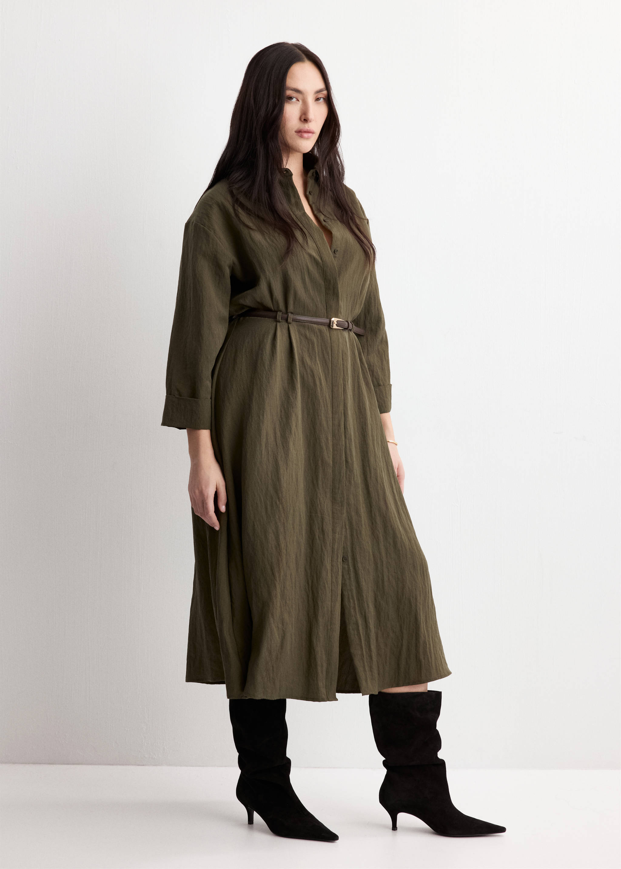 Khaki green midi shirt dress with long sleeves, a shirt collar, and a narrow belt.