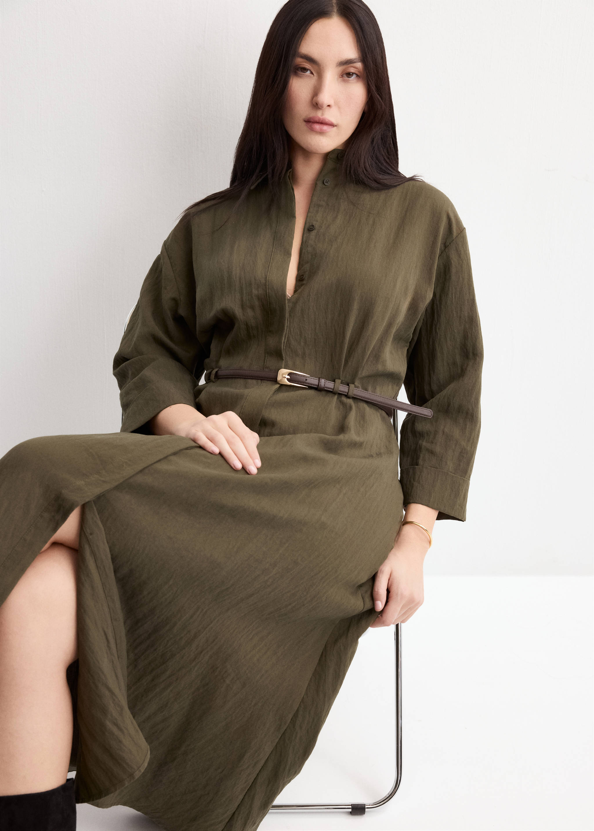 Khaki green midi shirt dress with a mandarin collar and a thin belt.