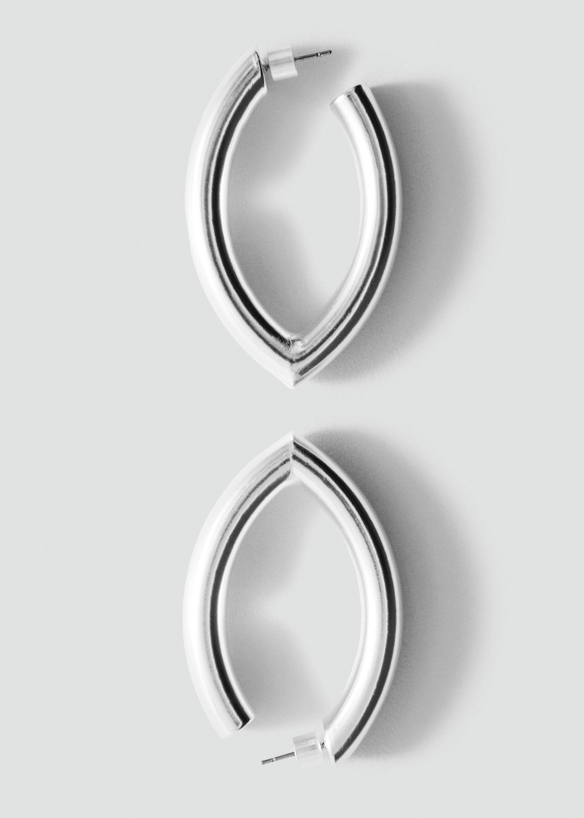Silver-toned metal hoop earrings with a pointed oval shape.