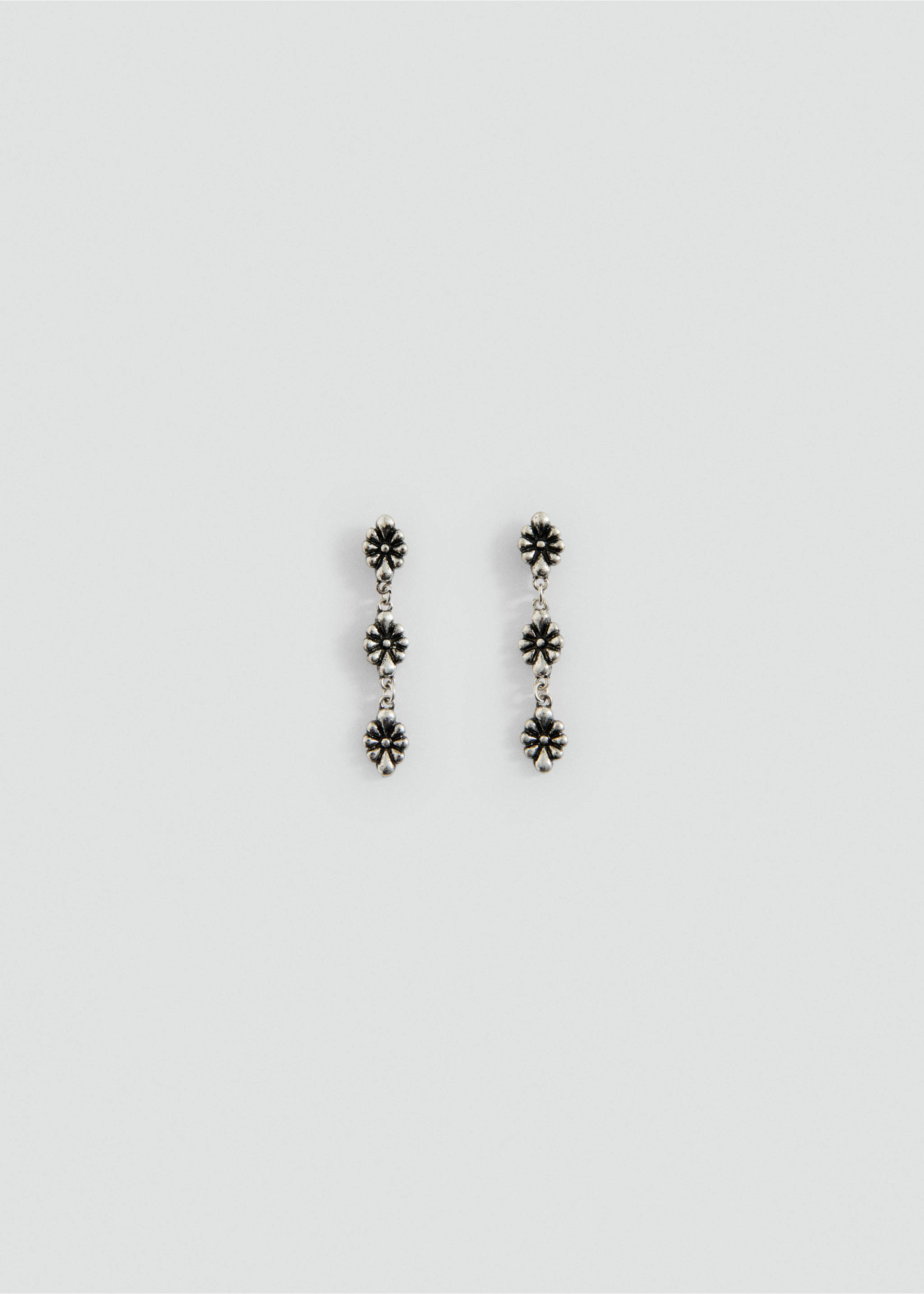 Silver drop earrings featuring a vertical chain of three floral charms., Silver. Ref: 27017927-00.