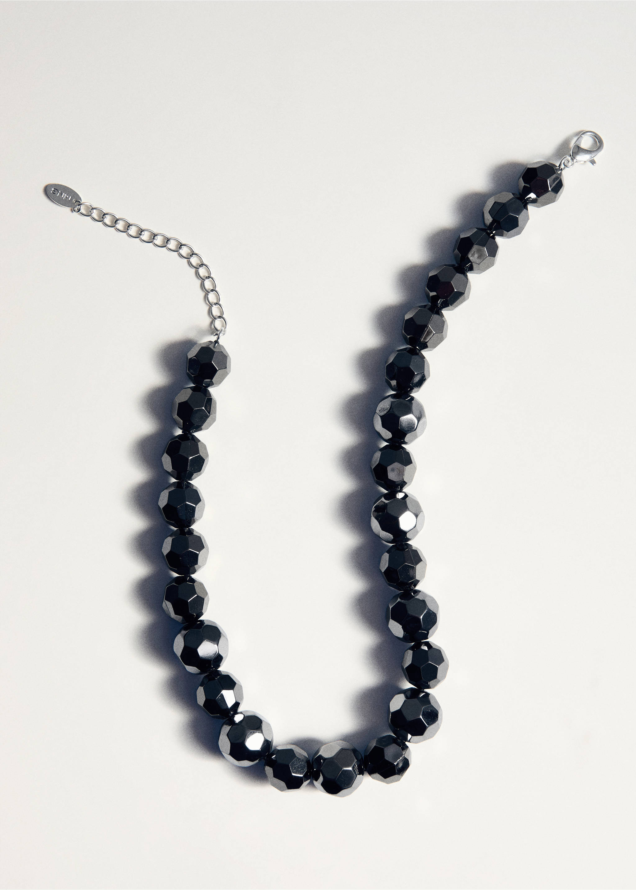 Chunky metallic faceted beaded collar necklace with a silver-tone extender chain., Silver. Ref: 27021228-00.