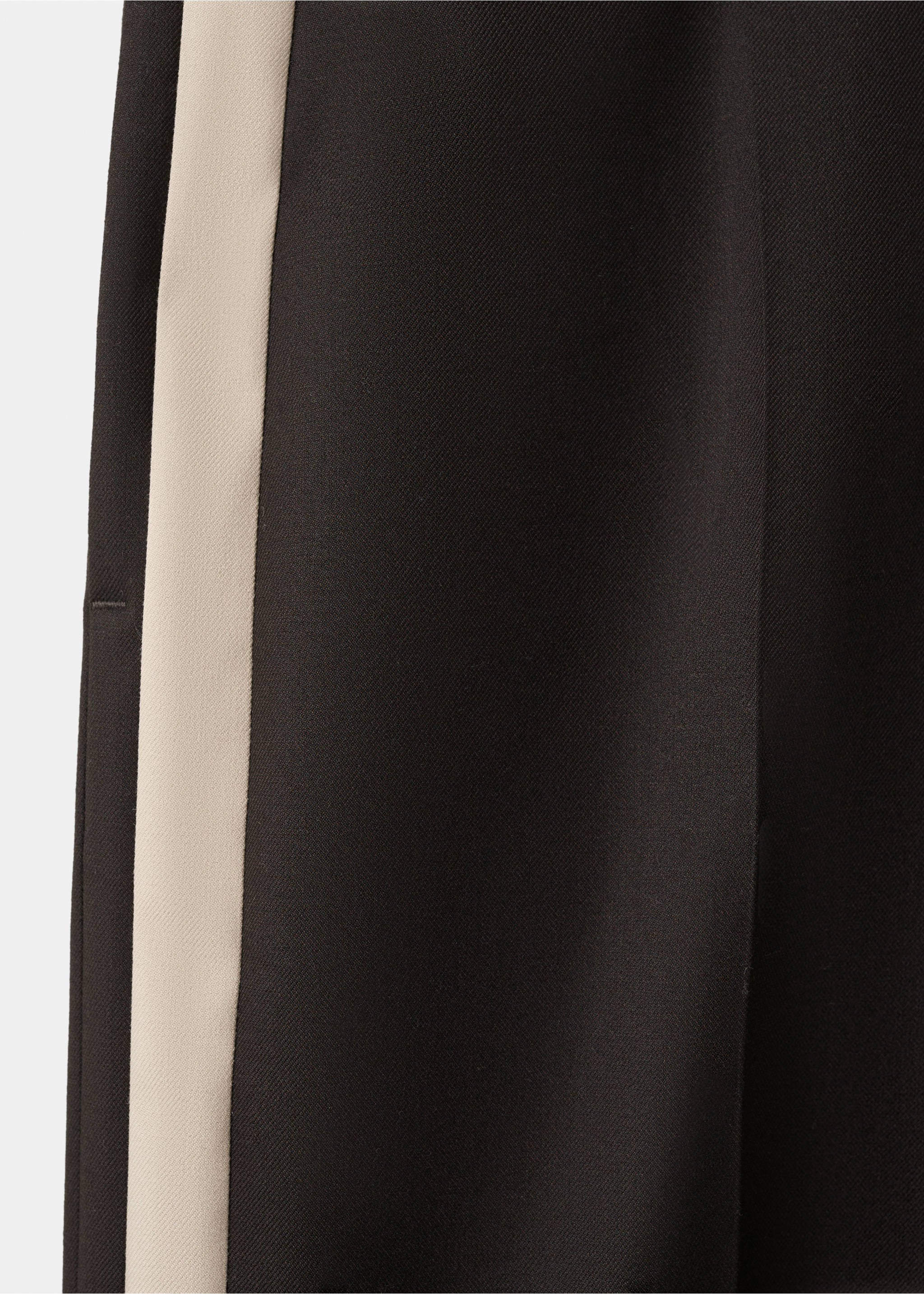 Close-up of black trousers with a wide cream side stripe fabric detail., Chocolate. Ref: 27021296-00.