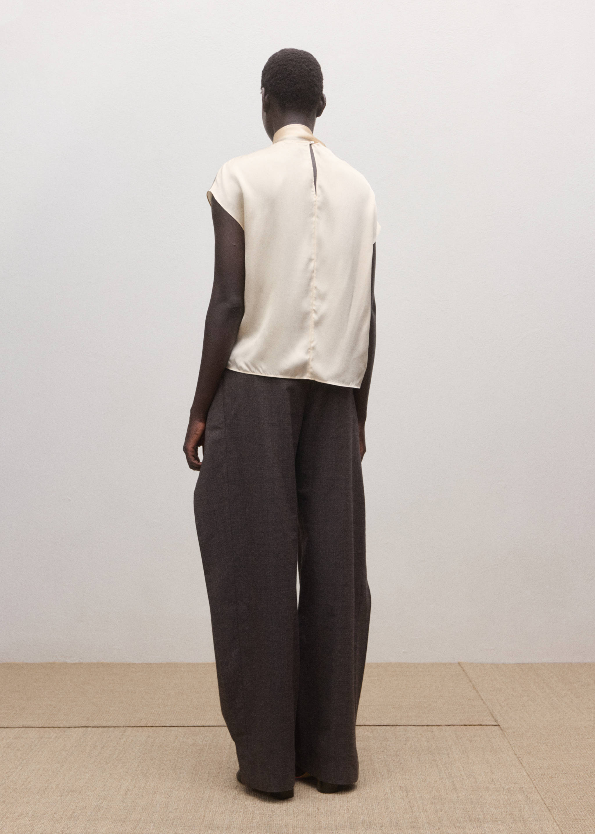 Cream short-sleeved blouse, back view