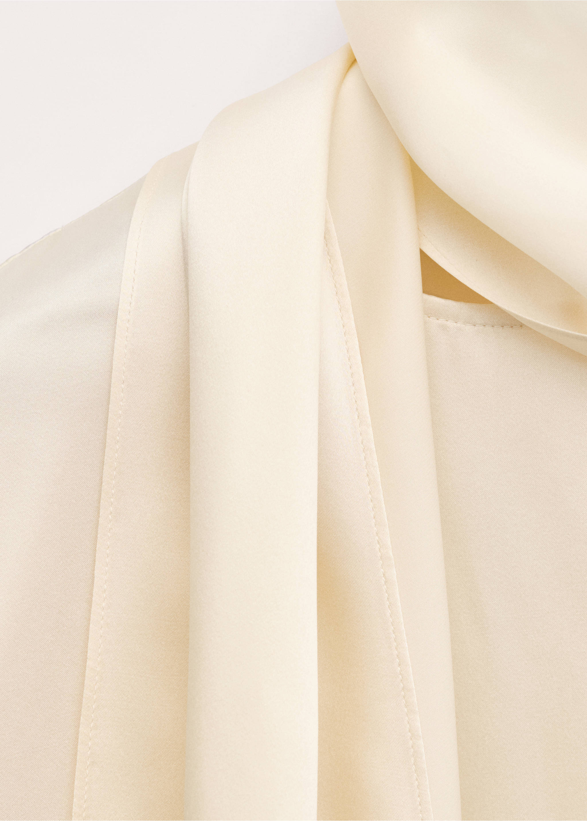 Close-up of cream blouse fabric showing smooth texture and drape., Ecru. Ref: 27024097-00.