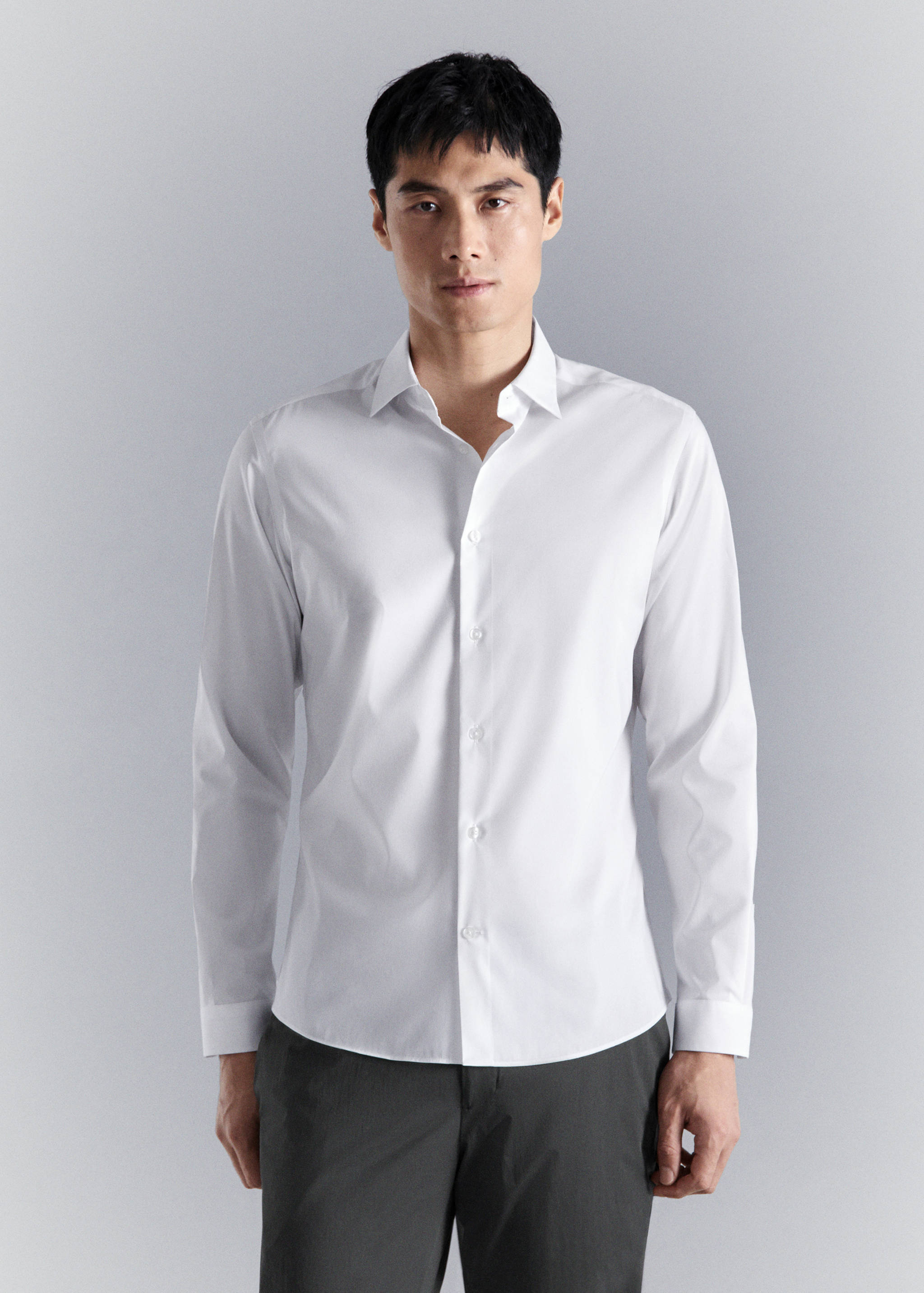 White long-sleeve shirt with a classic collar and button-down front.