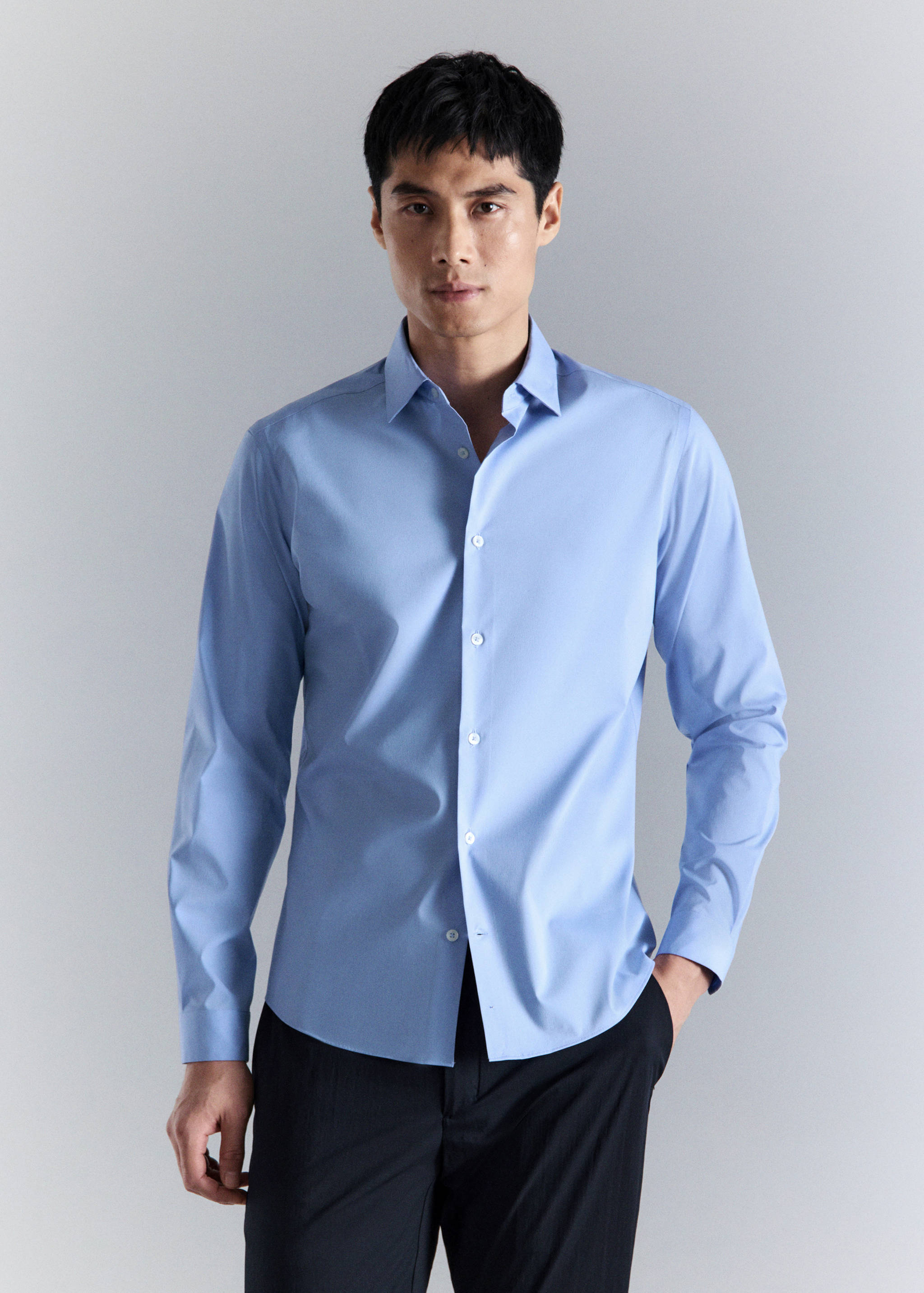 Light blue long-sleeved shirt with a classic collar and front buttons.