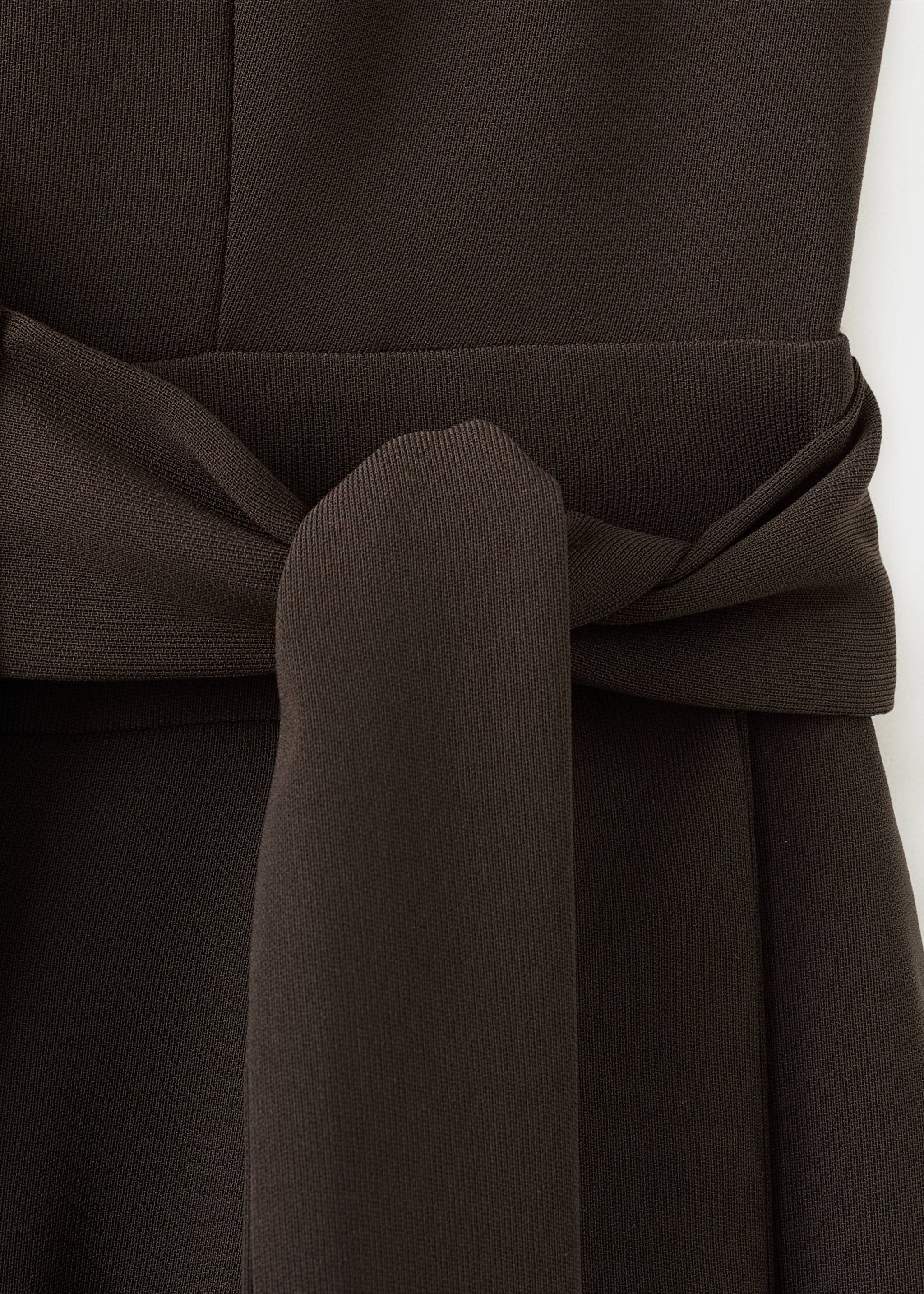 Close-up of a dark brown jumpsuit with a matching tie belt., Chocolate. Ref: 27025834-00.