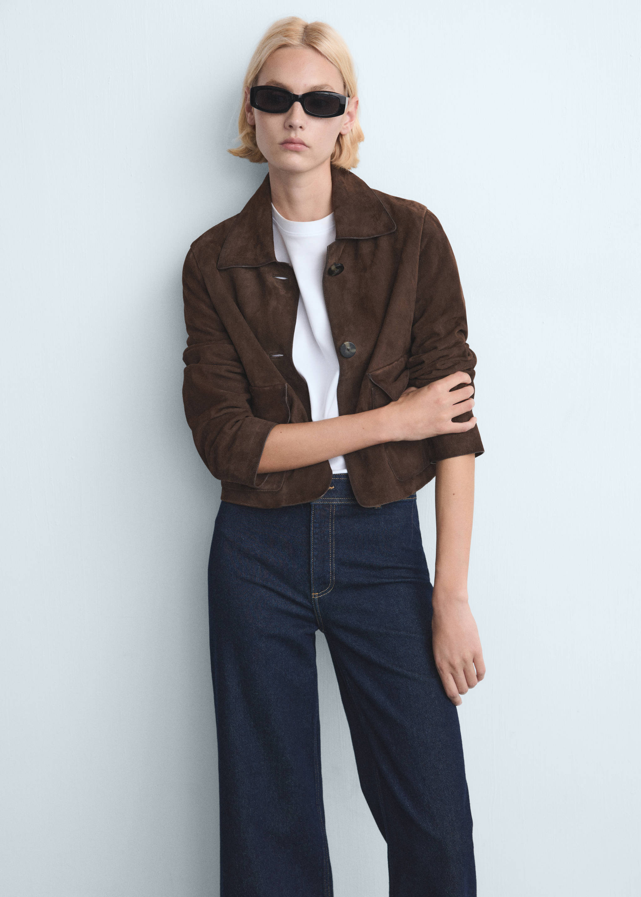 Dark brown suede jacket with a classic collar and front buttons