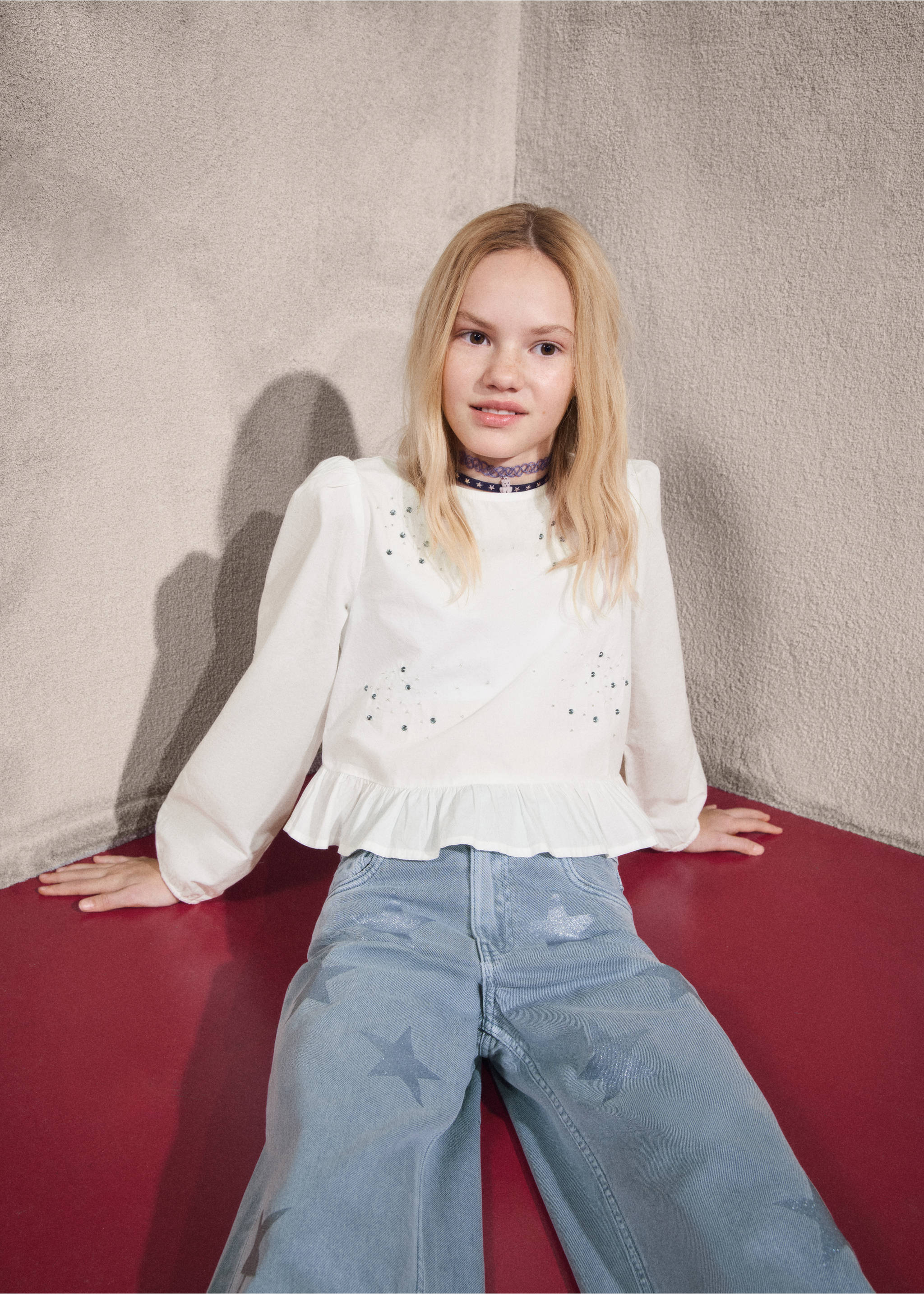 Blue denim jeans with a star pattern, worn with a white ruffled top., Blue. Ref: 27031289-00.