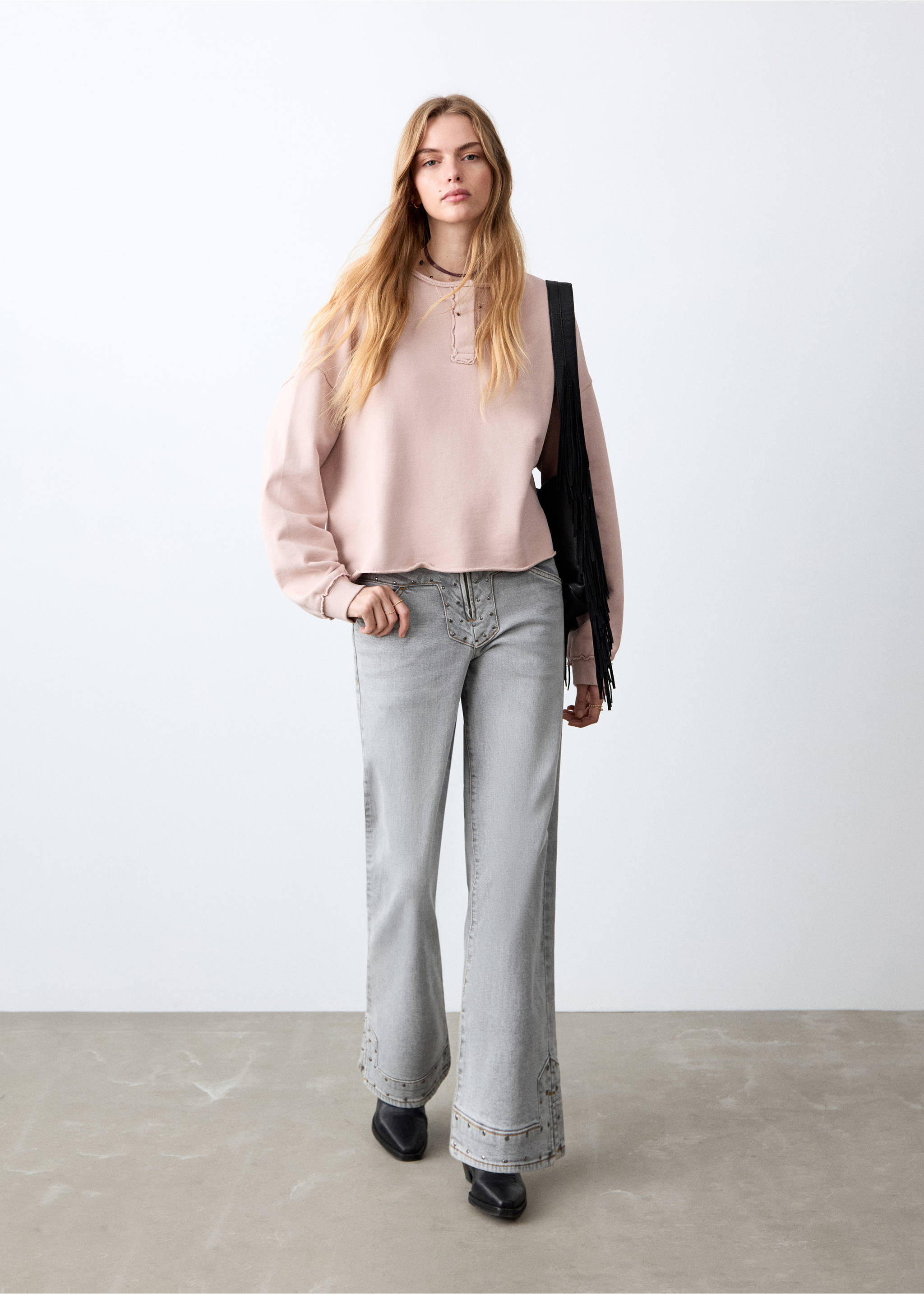 Pale pink sweatshirt with long sleeves and raw-edge hem, worn with grey flared trousers., Pink. Ref: 27031517-00.