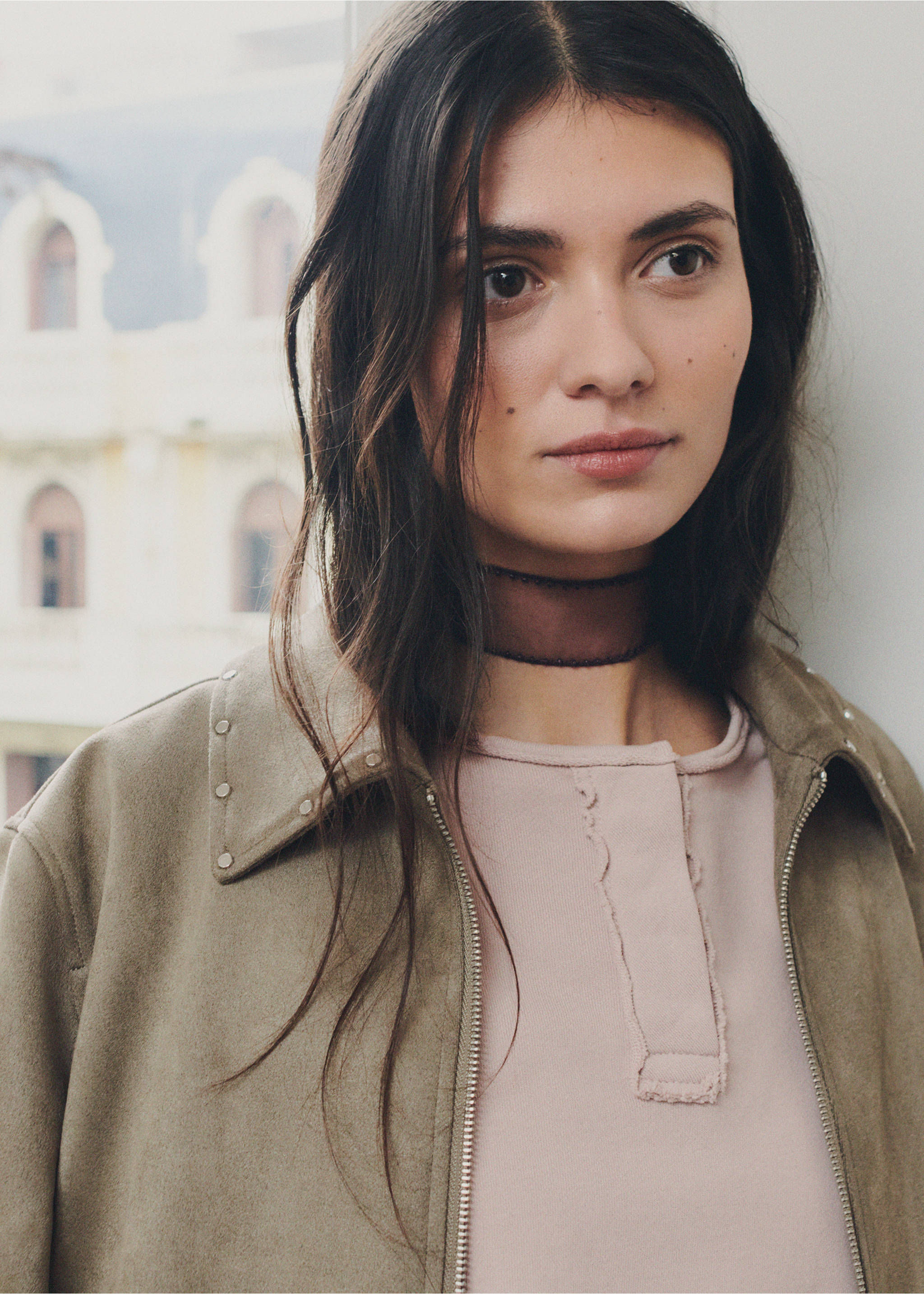 Pink sweatshirt with a raw-edge placket neckline, layered under an olive jacket., Pink. Ref: 27031517-00.