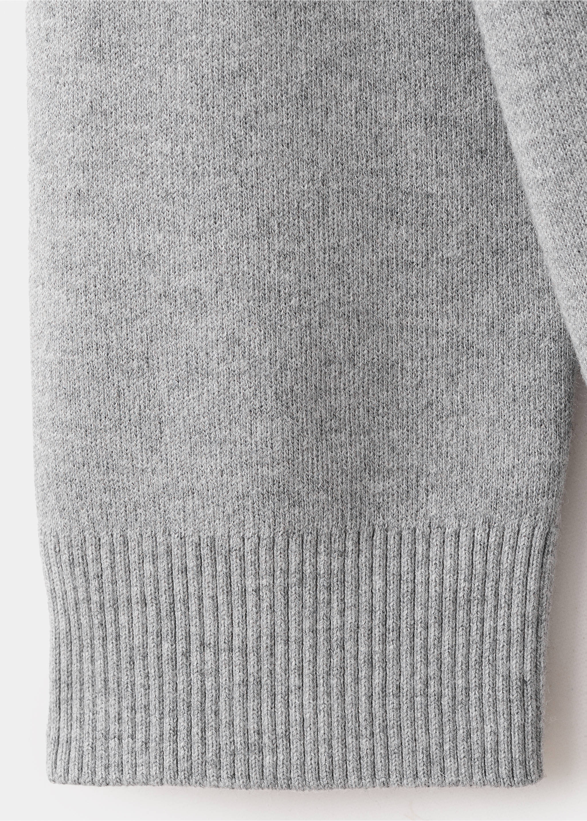 Close-up of the grey knitted fabric and ribbed hem of a cardigan., Medium Heather Grey. Ref: 27034774-00.