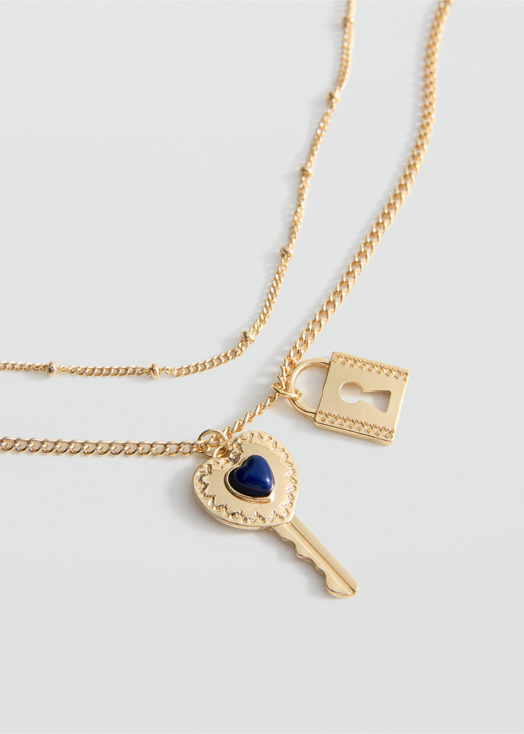 Gold-coloured double-strand necklace with padlock and key charms., Gold. Ref: 27035163-00.