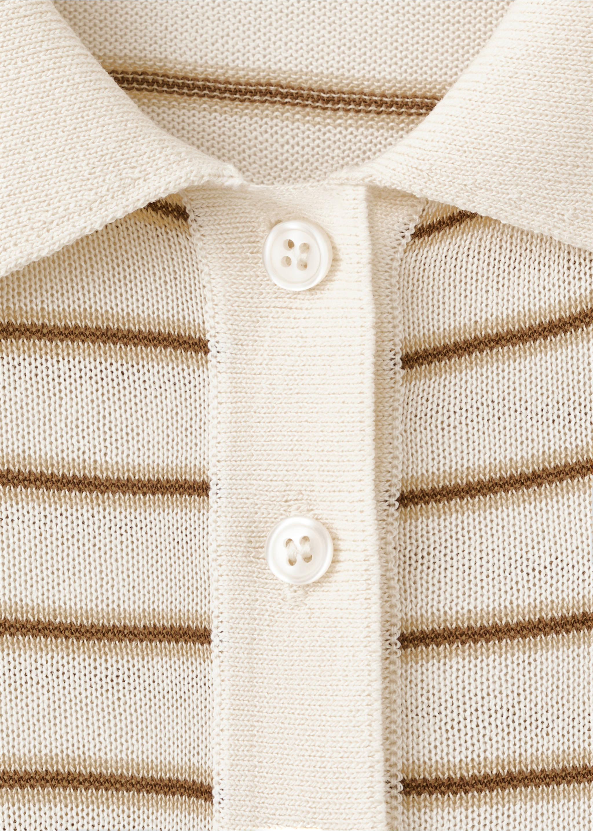 Close-up of a striped knit jersey collar and button placket., Ecru. Ref: 27035821-00.