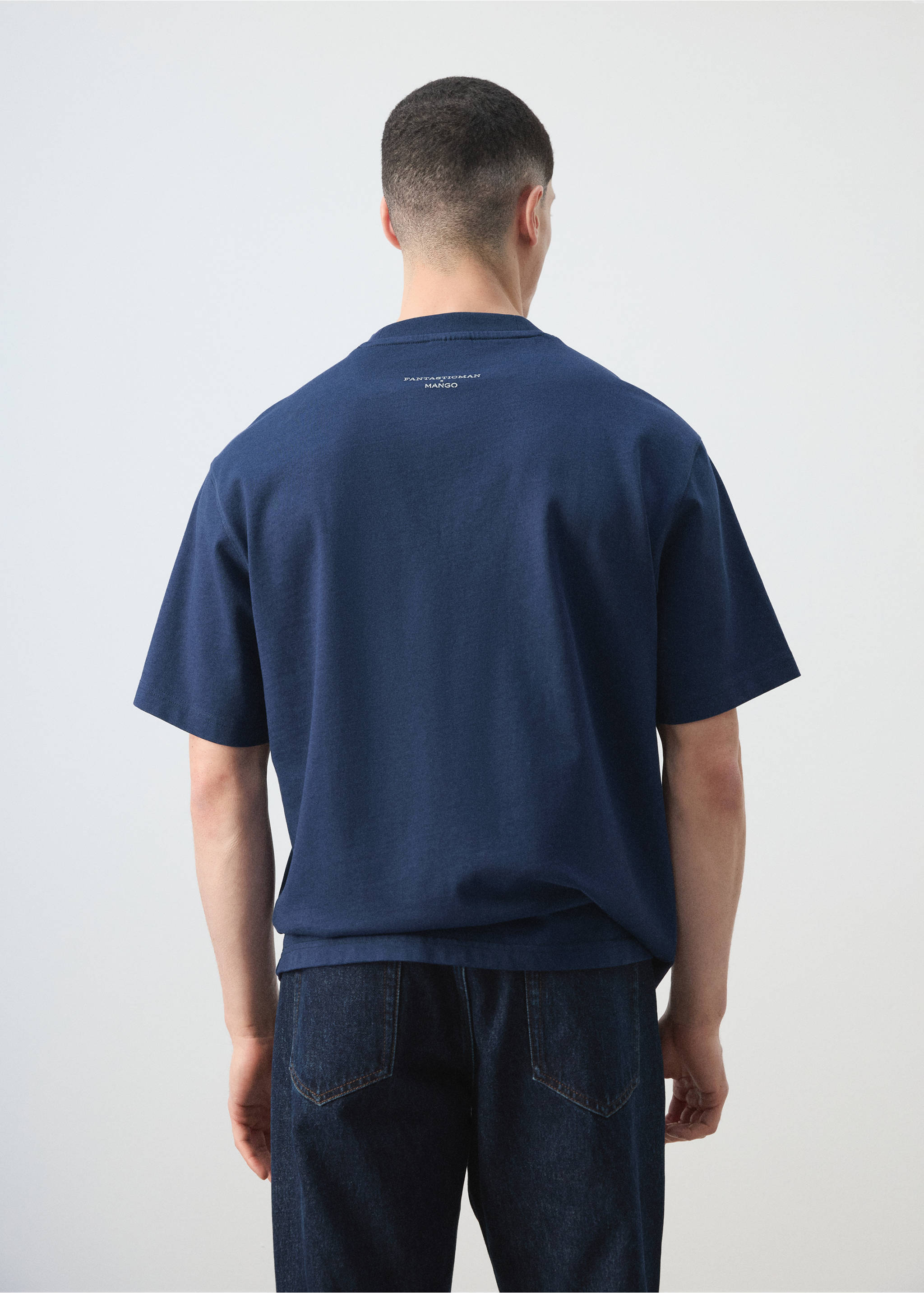 Navy blue short-sleeved t-shirt in a relaxed fit, shown from the back., Ink Blue. Ref: 27035991-00.