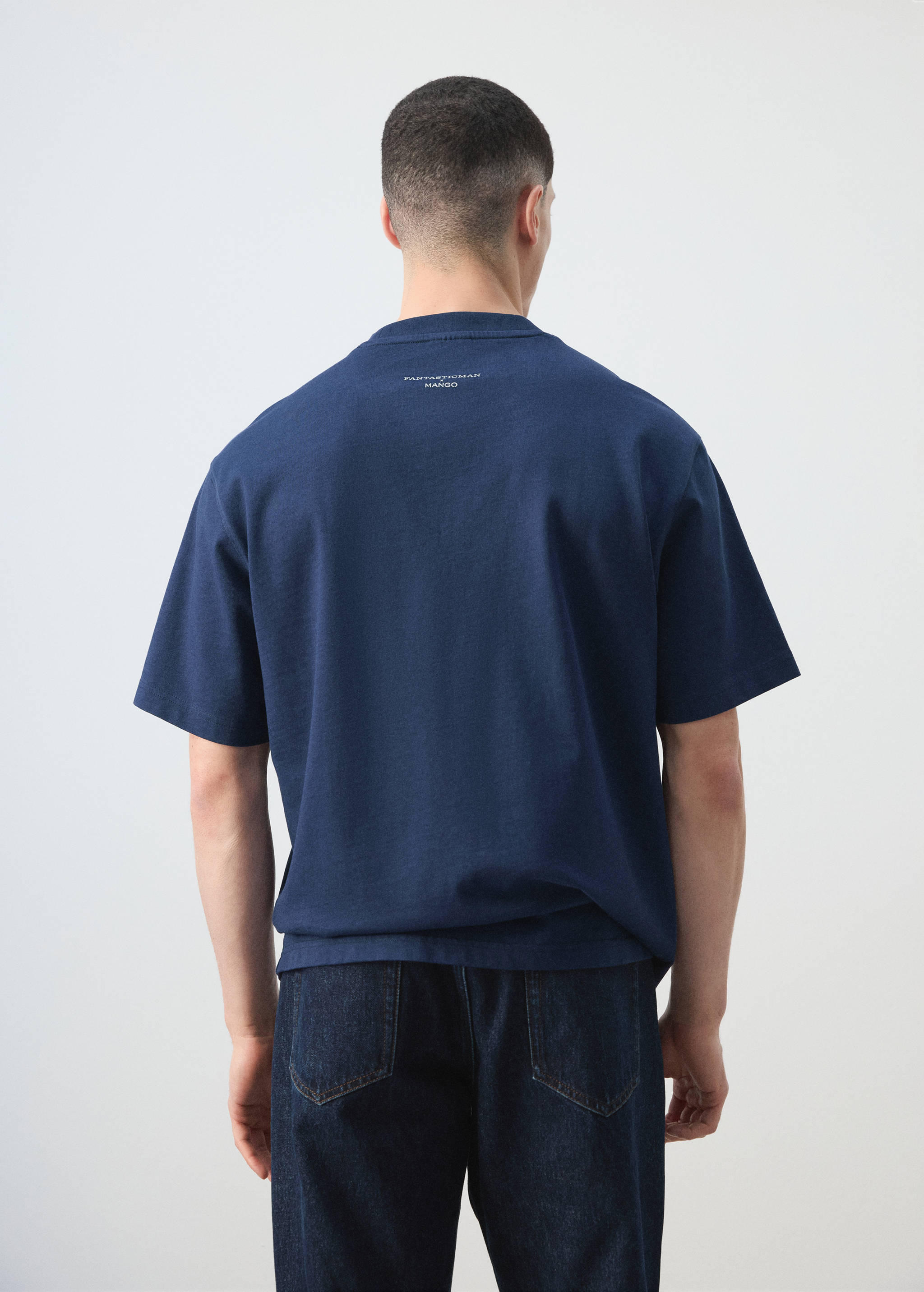 Navy blue short-sleeved t-shirt in a relaxed fit, shown from the back.