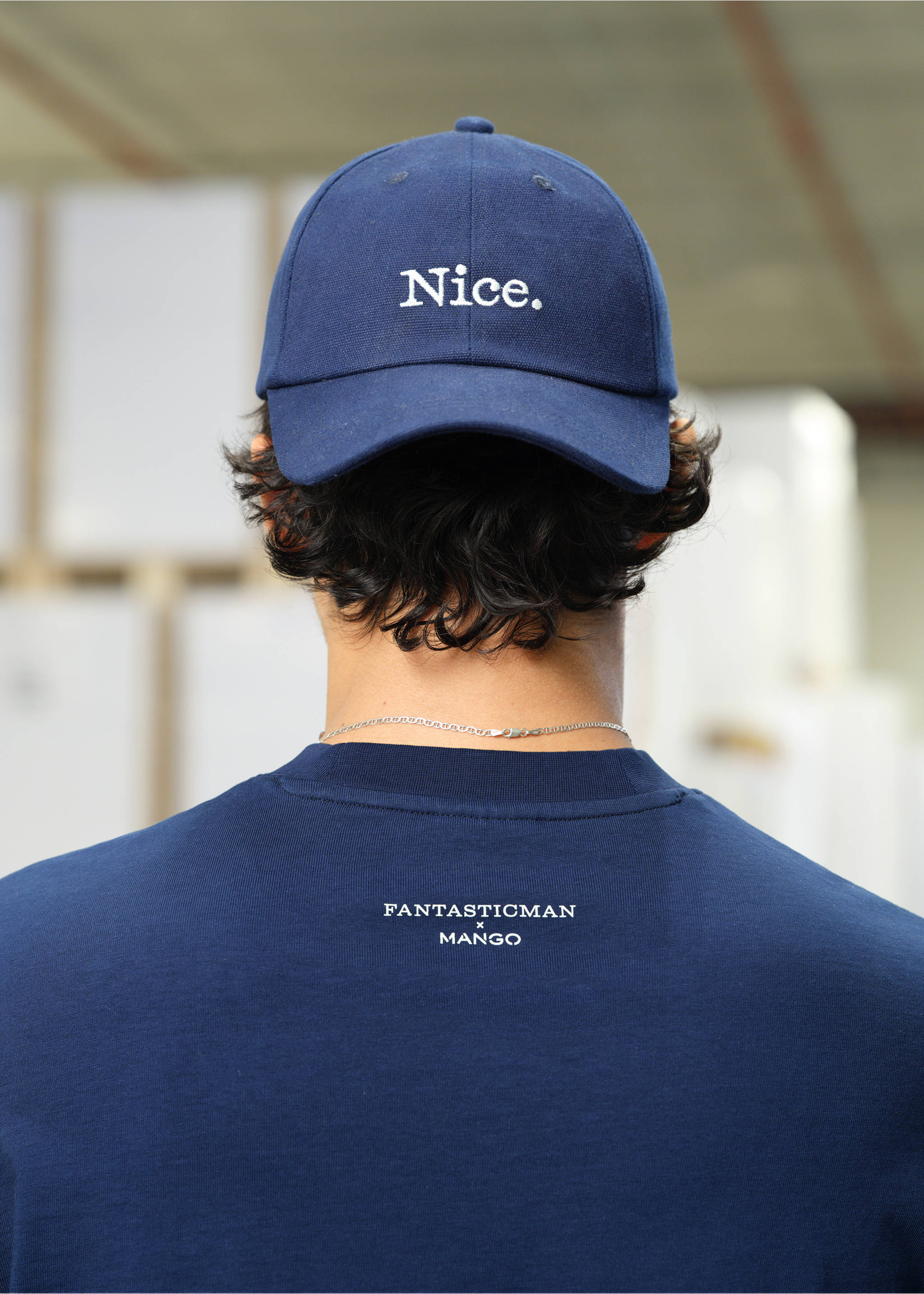 Dark blue t-shirt with white chest text, styled with a matching embroidered cap., Ink Blue. Ref: 27035991-00.