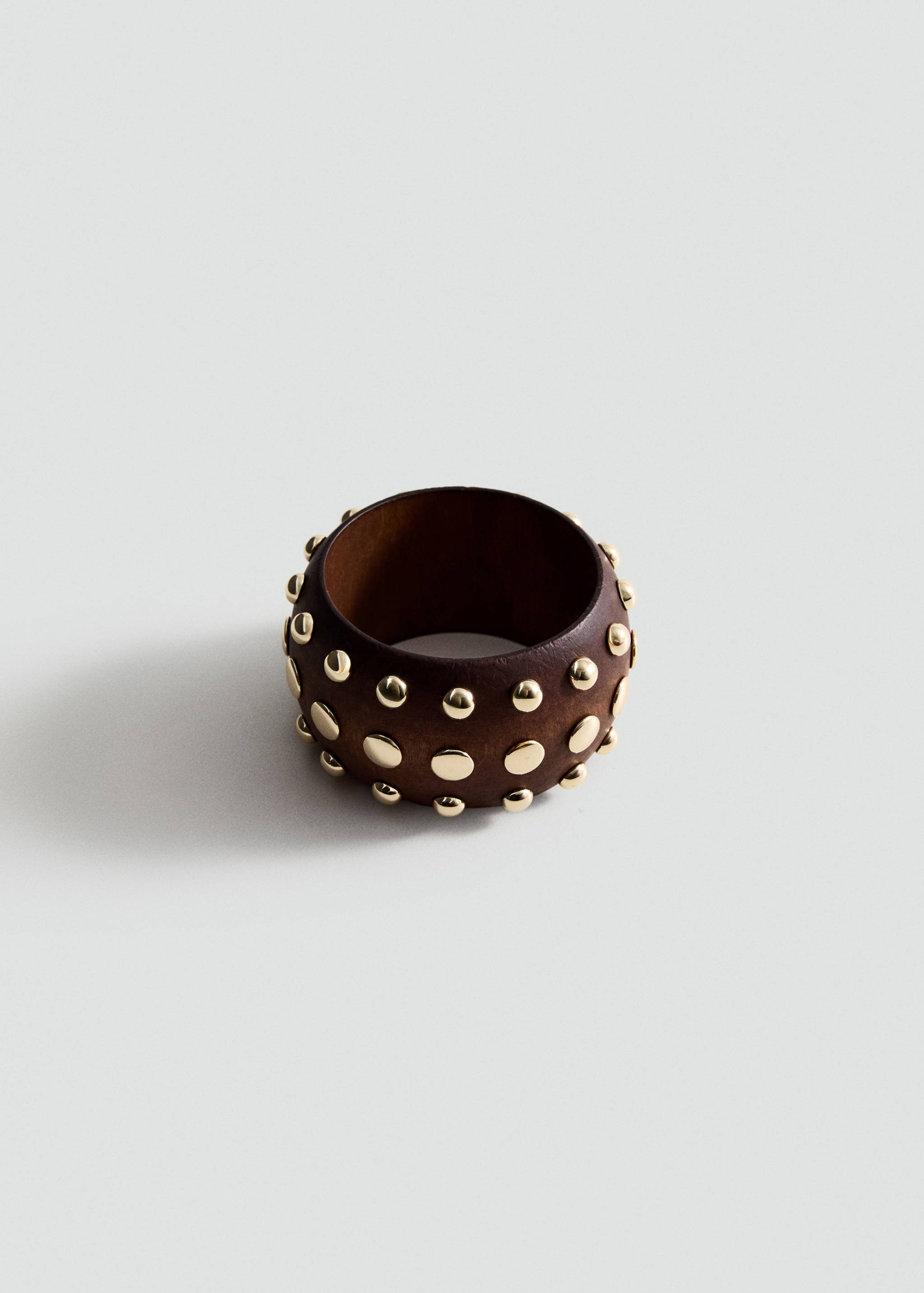 Dark brown wooden cuff bracelet embellished with polished gold-tone dome studs.