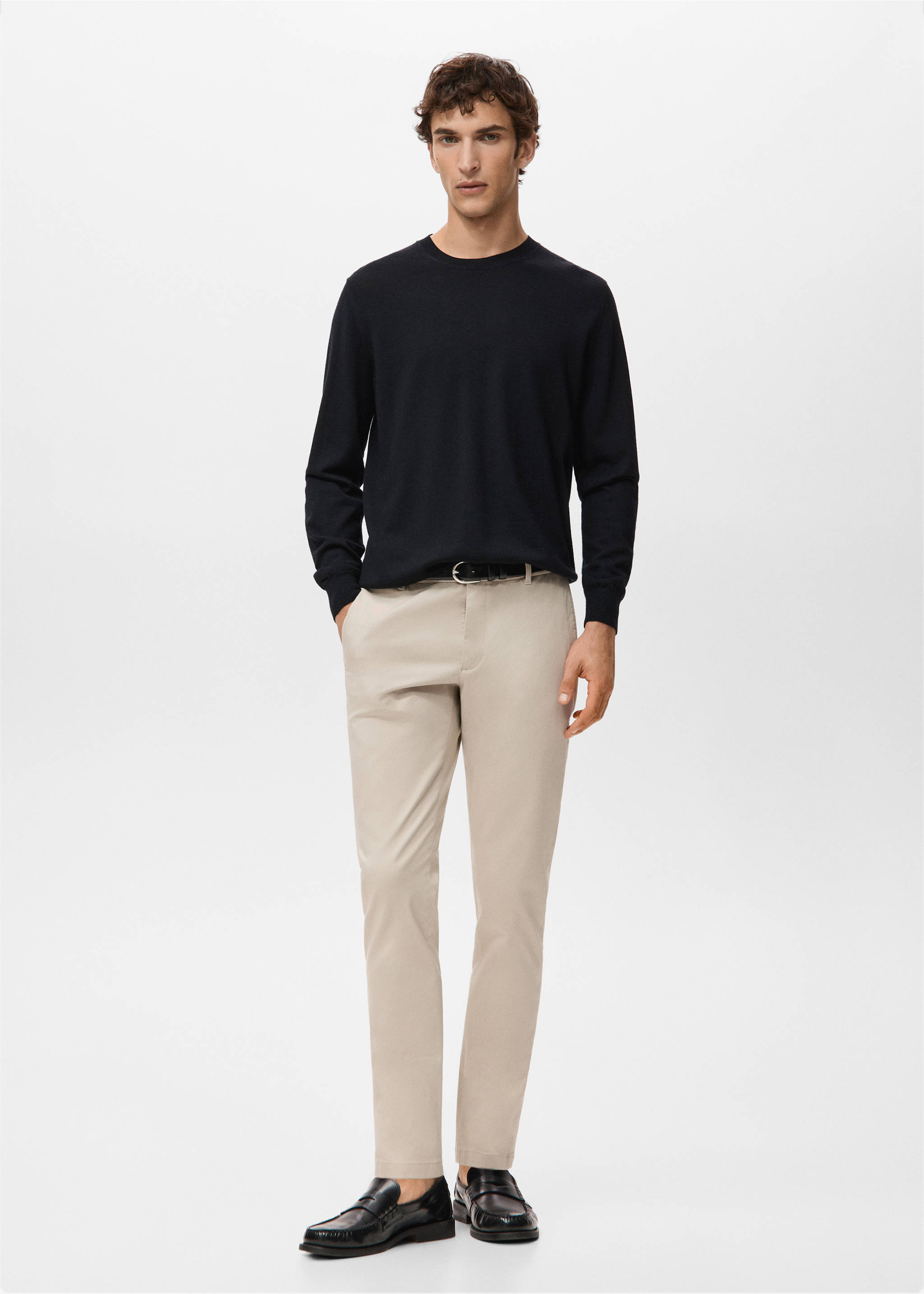 Beige trousers styled with a dark blue crew-neck sweater and black loafers., Sand. Ref: 27041187-00.